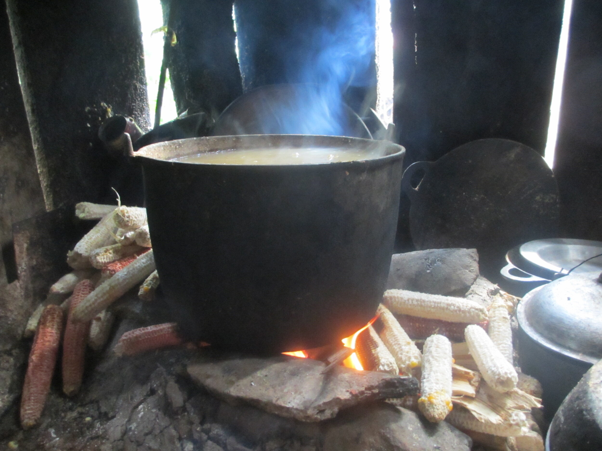 Stone Stove Using Corn Cobbs for Cooking Fuel