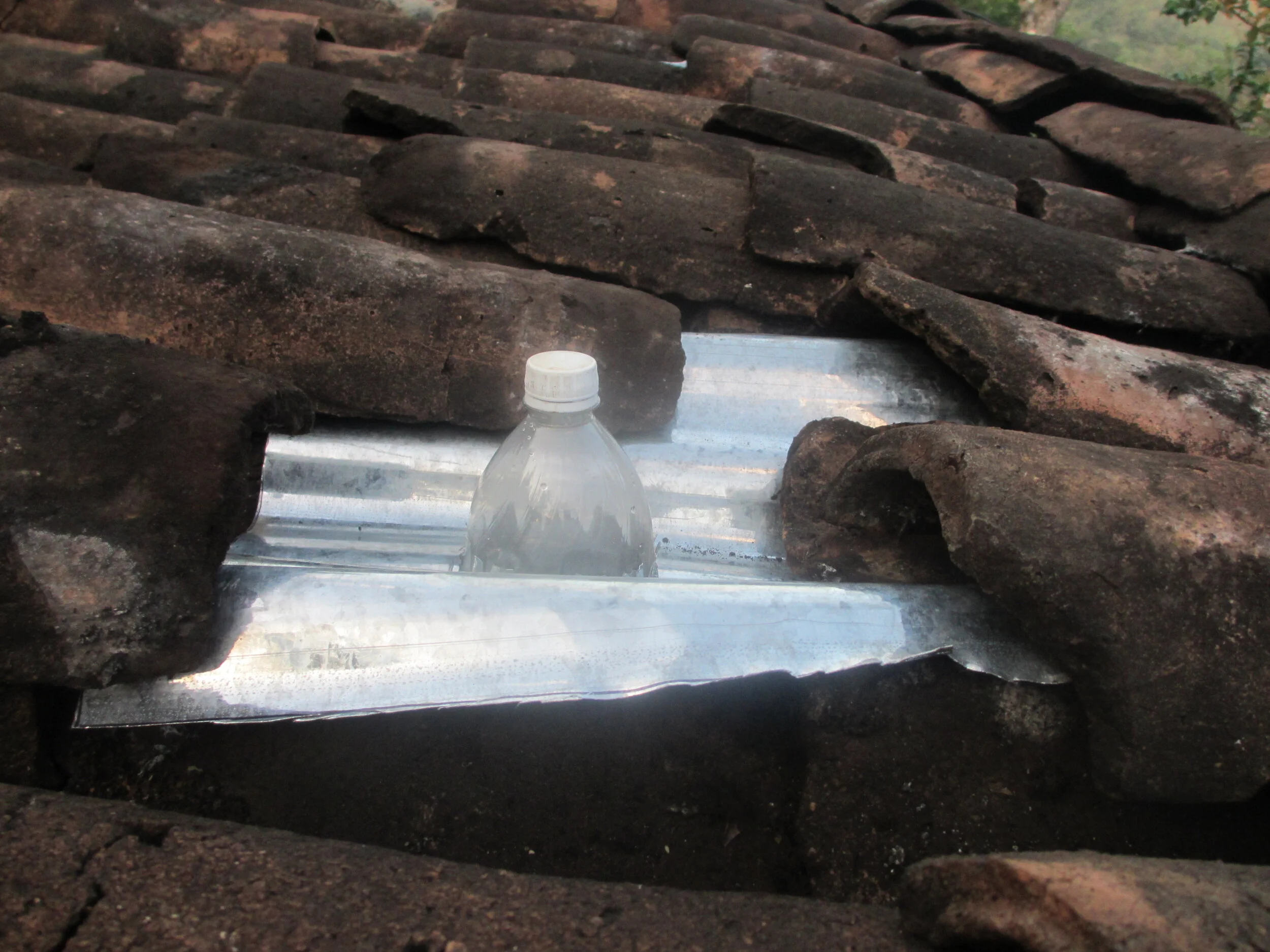 Soda Bottle Light Installed Viewed From Outside of the Roof