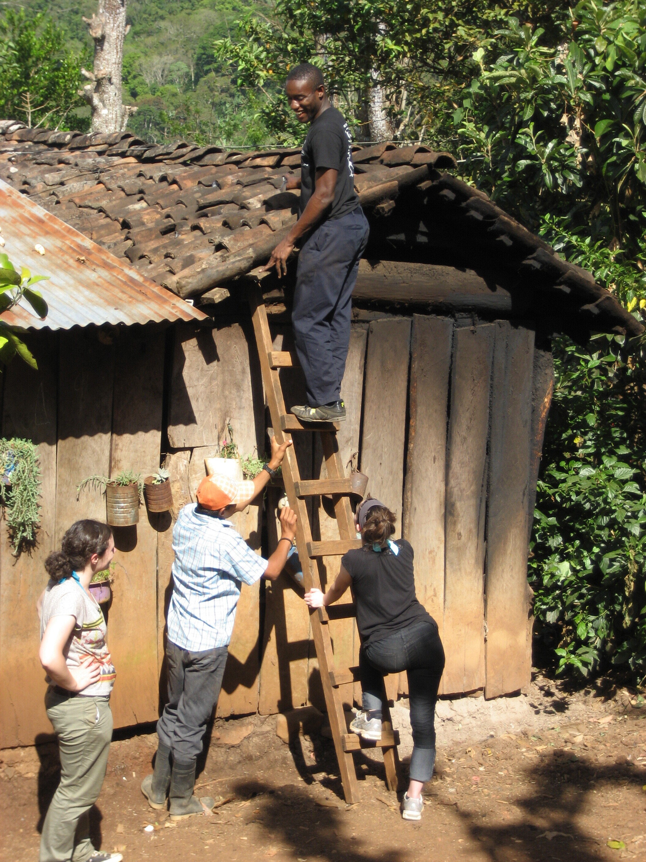 Students Installing Bottle Light in the Roof