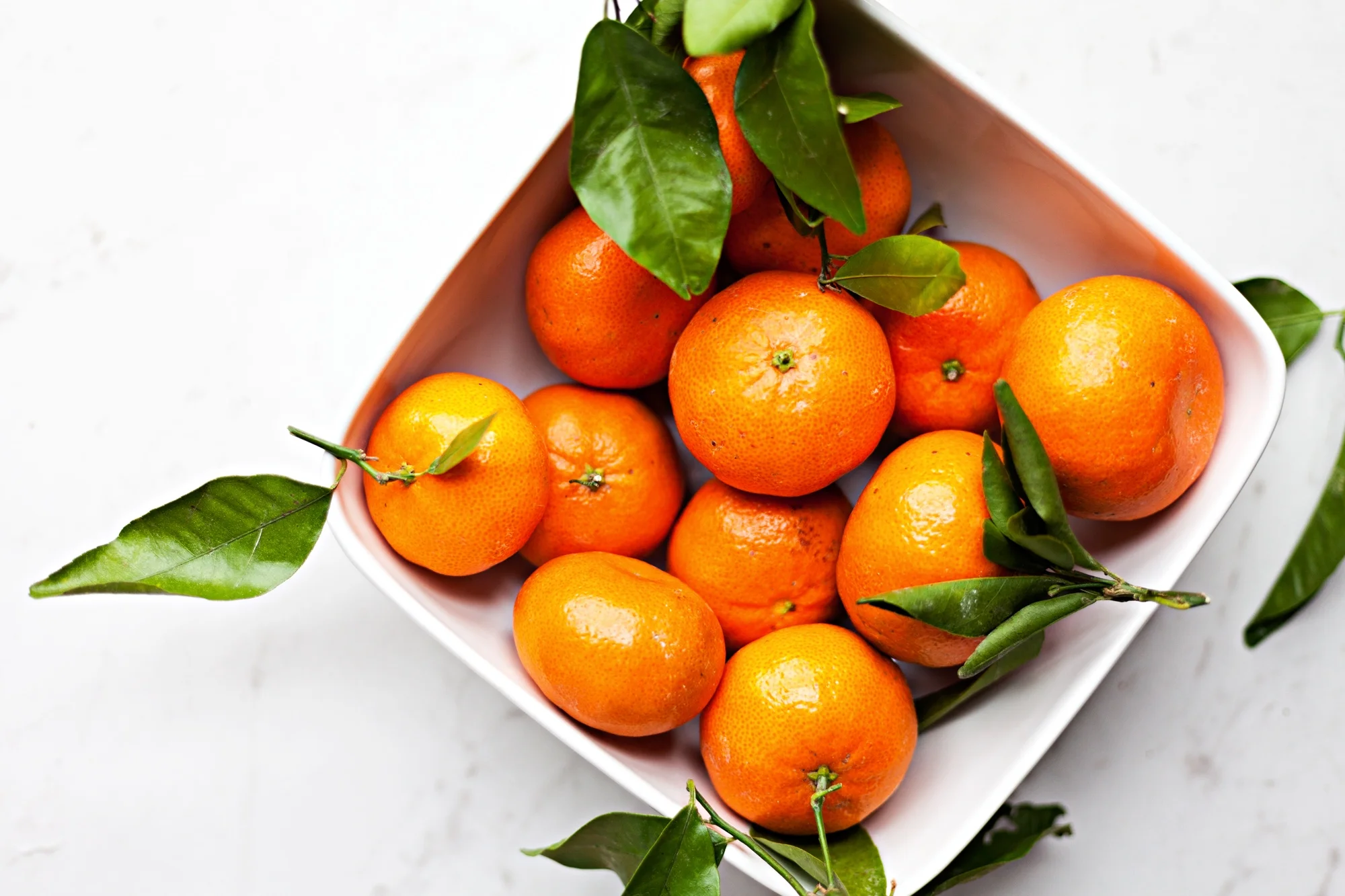 Photograph of some oranges in a bowl, part of the Food Photography series.