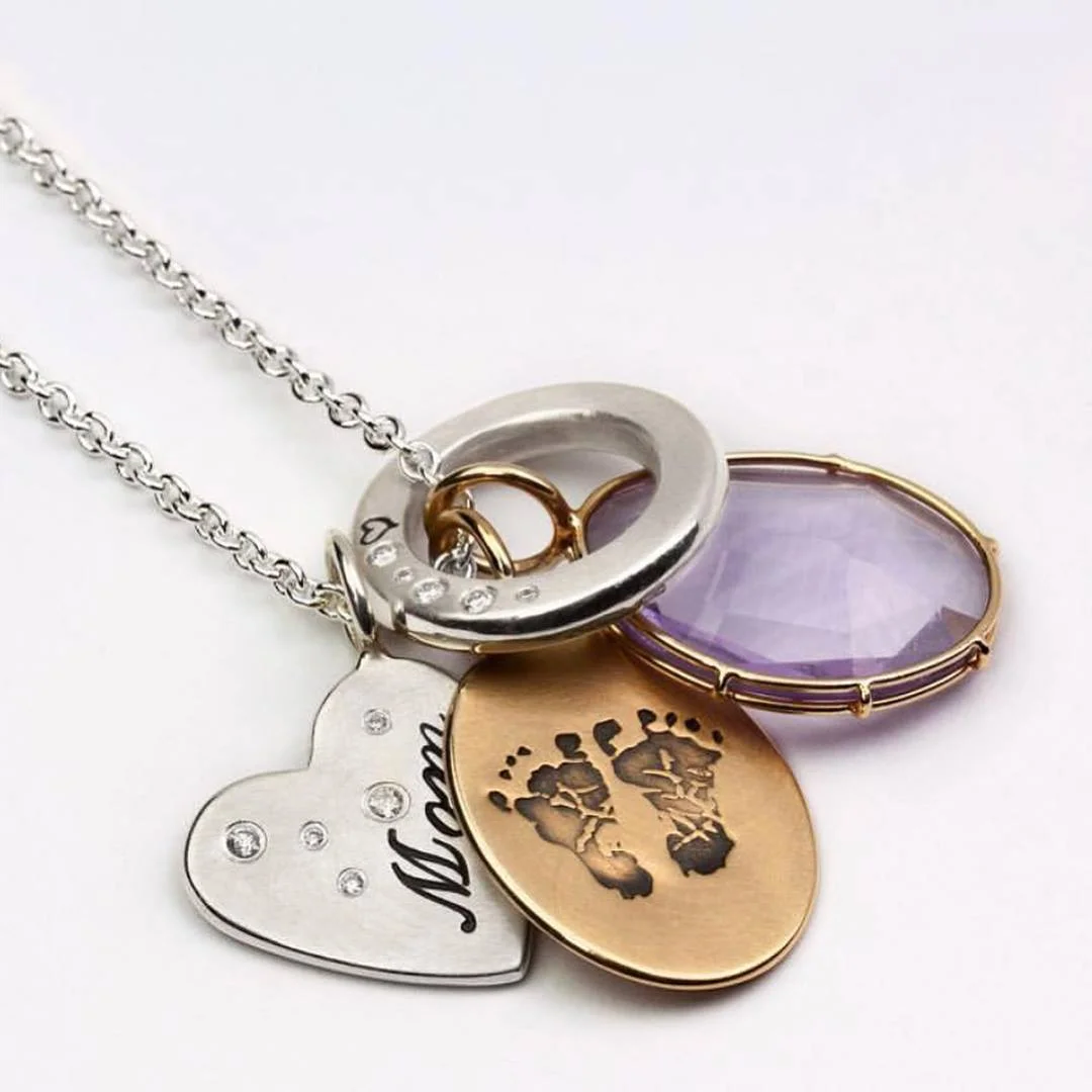 Heather B. Moore personalized jewelry features a freehand technique where each character is hand stamped.
