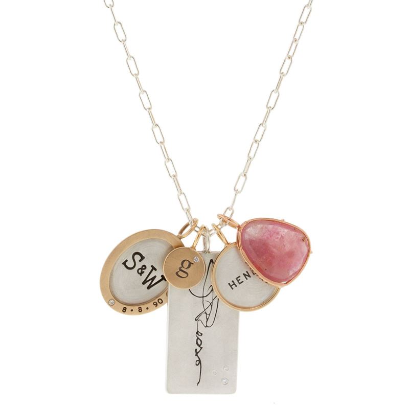 Heather B. Moore personalized jewelry features a freehand technique where each character is hand stamped.