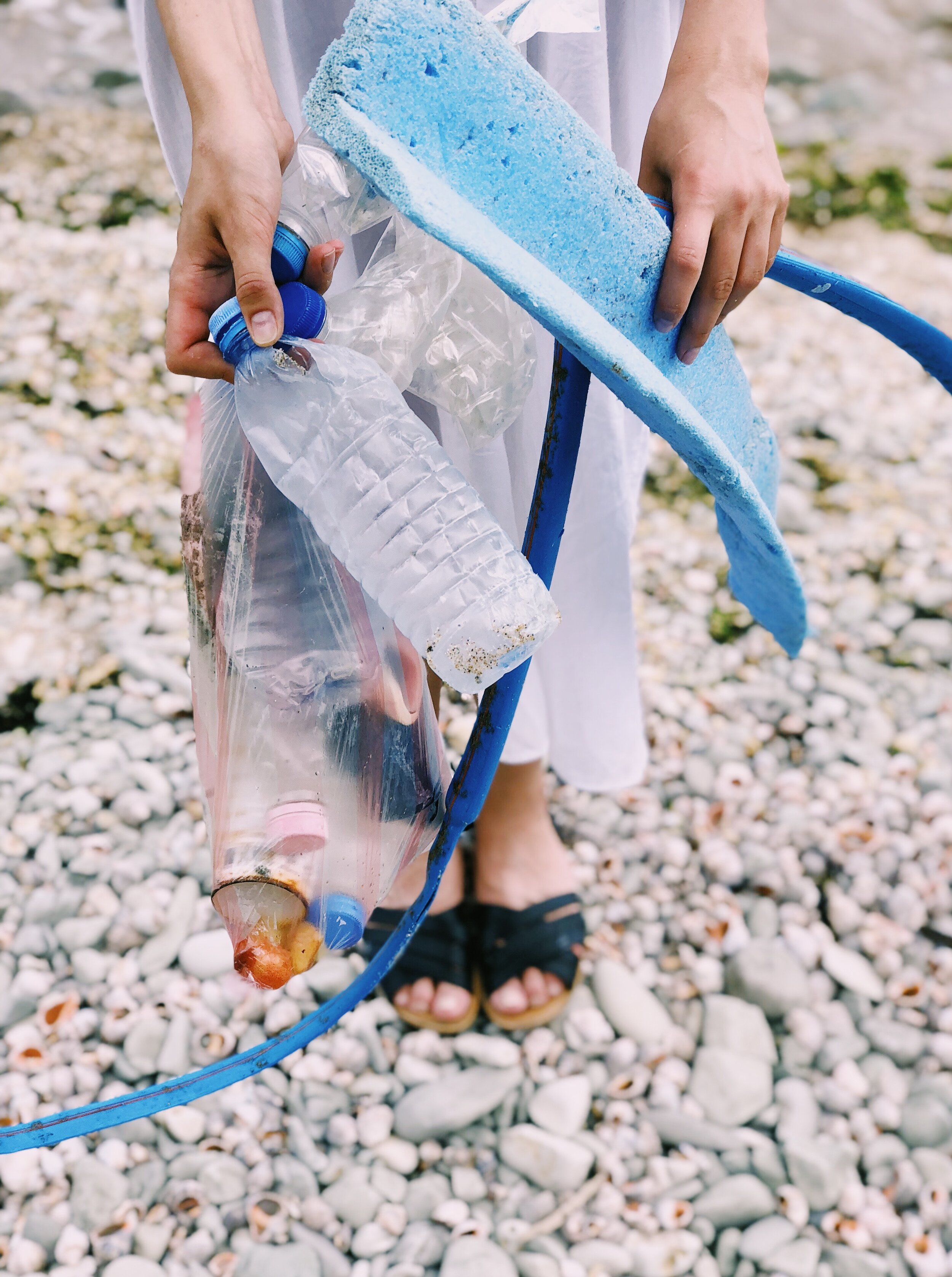 person-holding-plastic-bottles-and-hose-1201589 (1).jpg