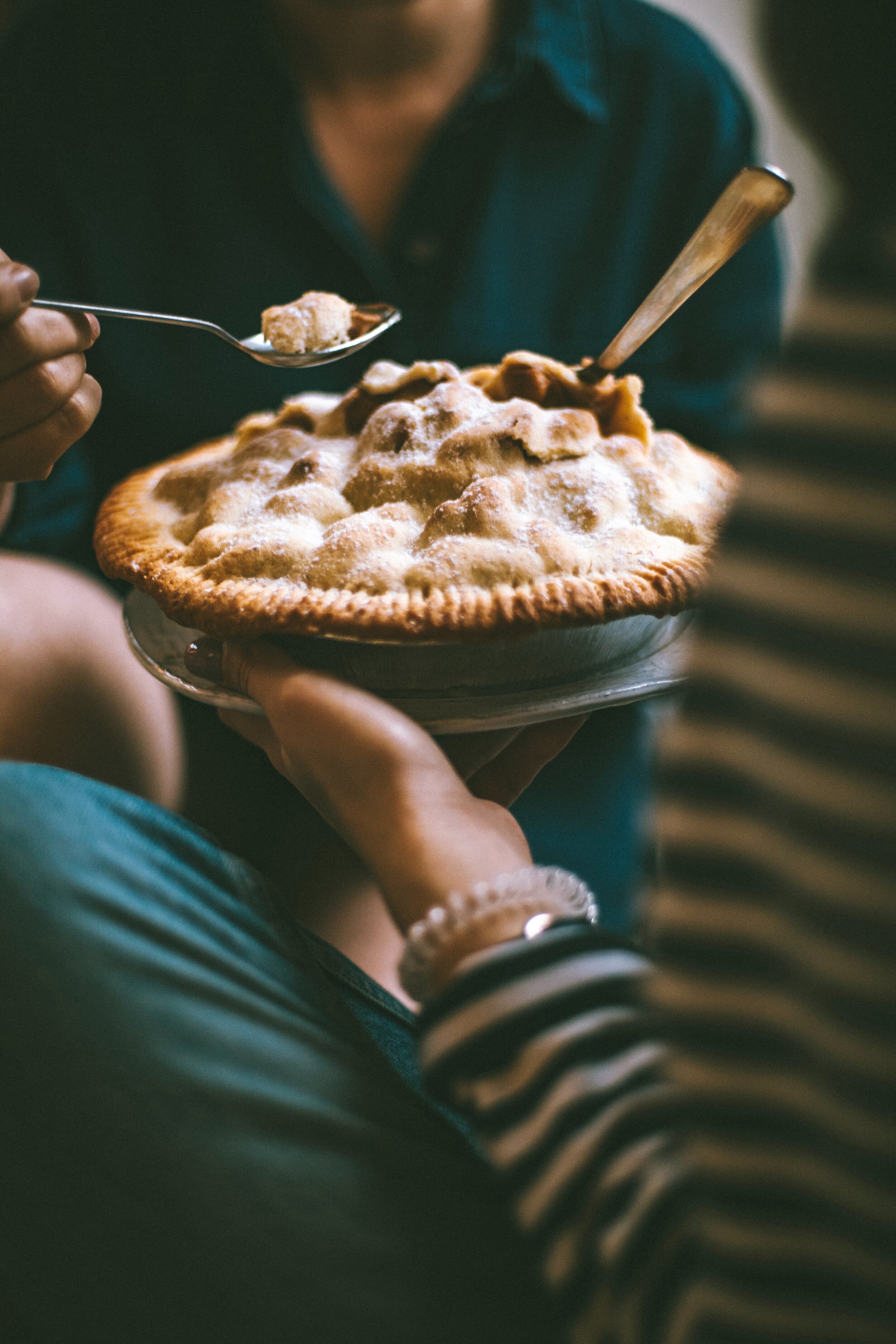 person-holding-pie-and-spoon-1619495.jpg