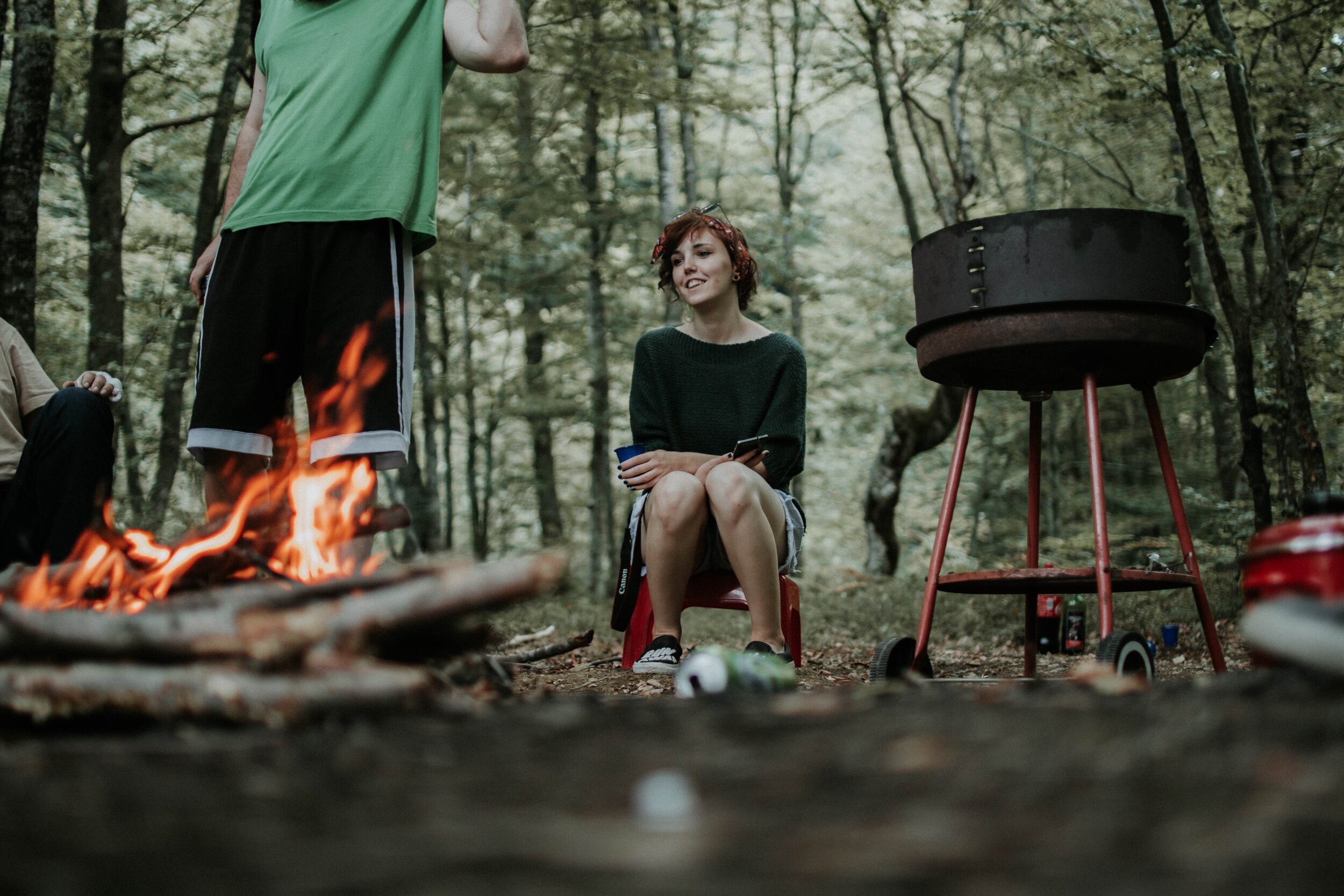 man-and-woman-gathering-around-a-bonfire-1414221.jpg