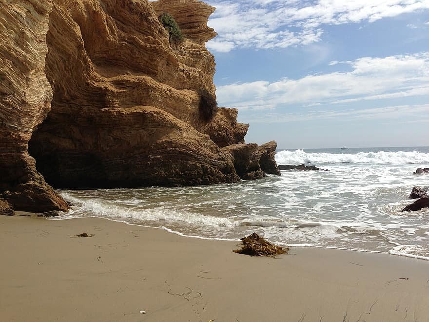 crystal-cove-treasure-cove-cliff-ocean-waves-beach-cave.jpg