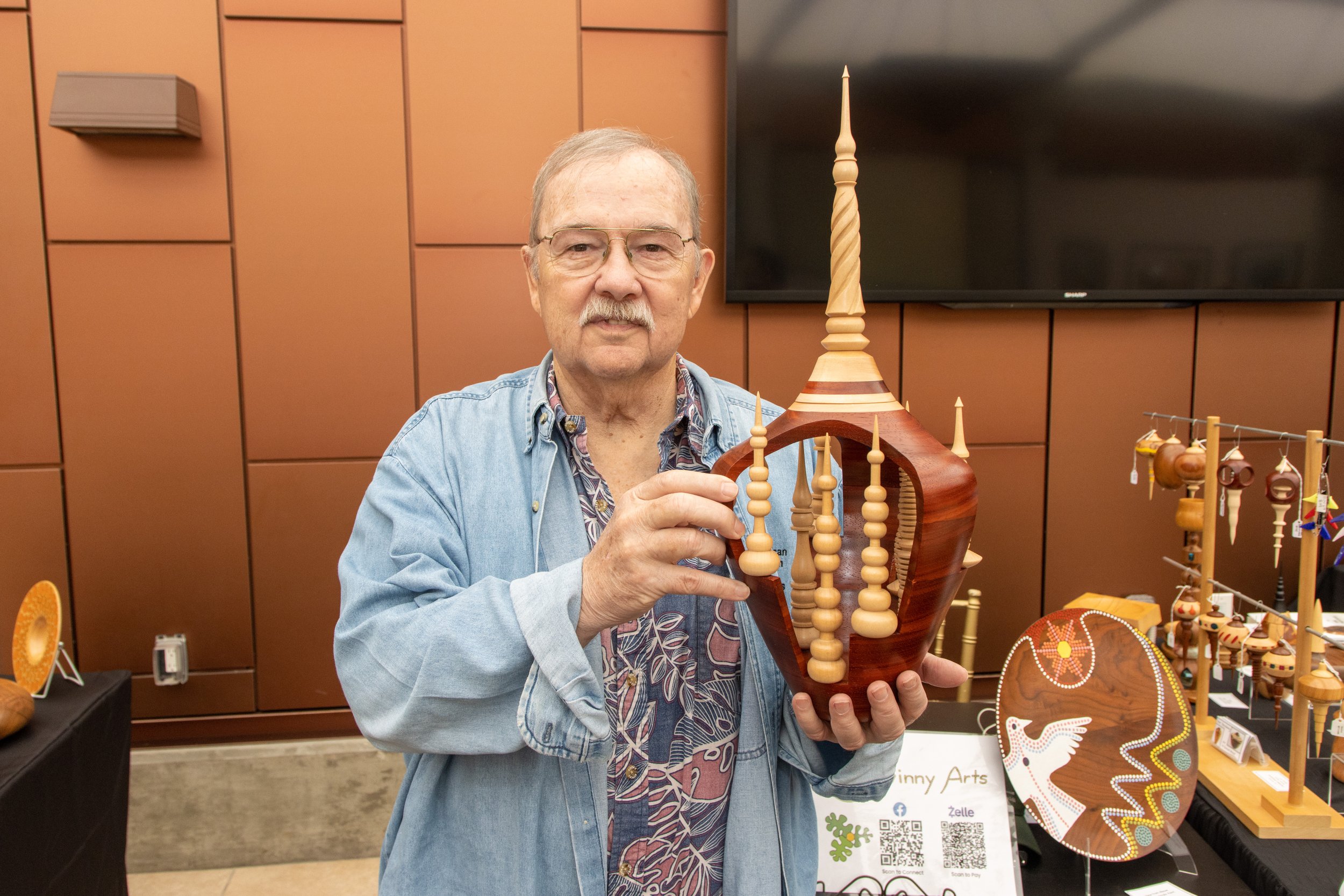 Joe Devinny, Wood Carver holding Finial Explosion made of rosewood basswood