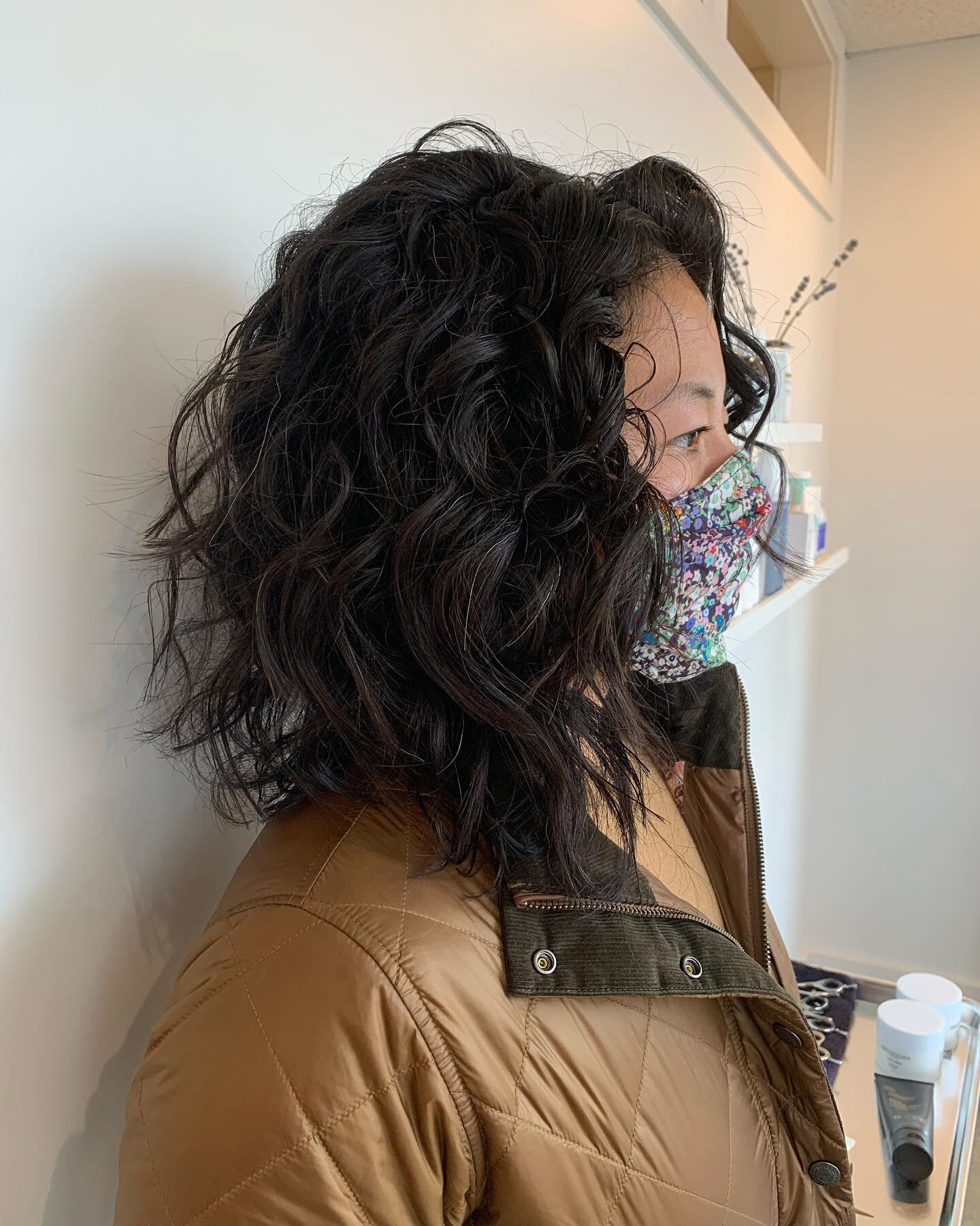 This lovely lady had been chemically relaxing for years until she arrived in my chair. She was so ready to embrace her texture.  She has bigger coils in the back and more of a wave on the top and sides.  This layered textured bob brought out the best
