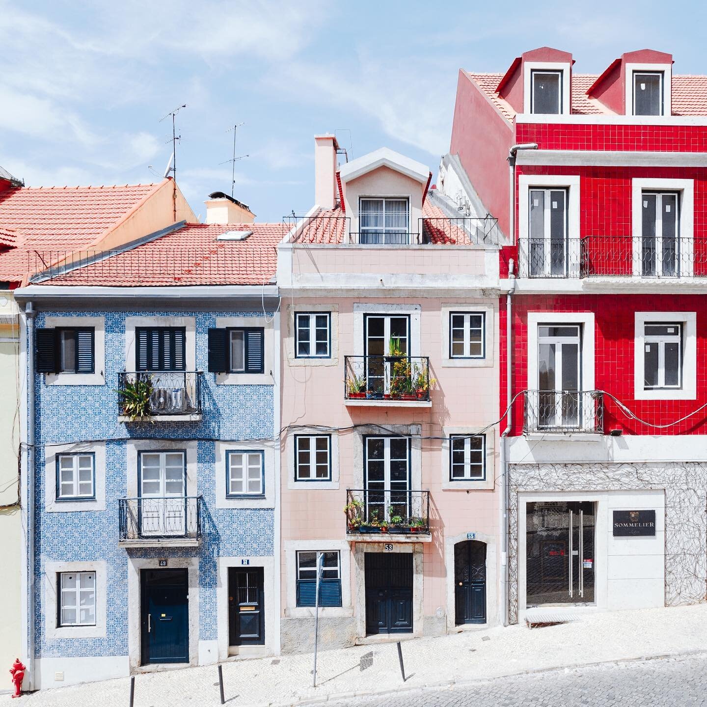 Blue skies and candy-colored homes 🍭 via Hugo Sousa