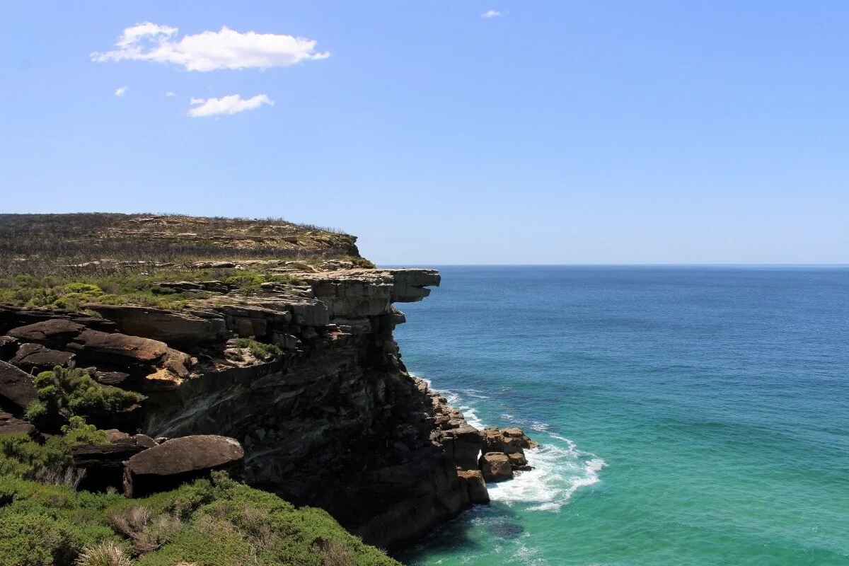 Eagle Rock sandstone headland viewed from the coastal walk, Royal National Park, with turquoise ocean below