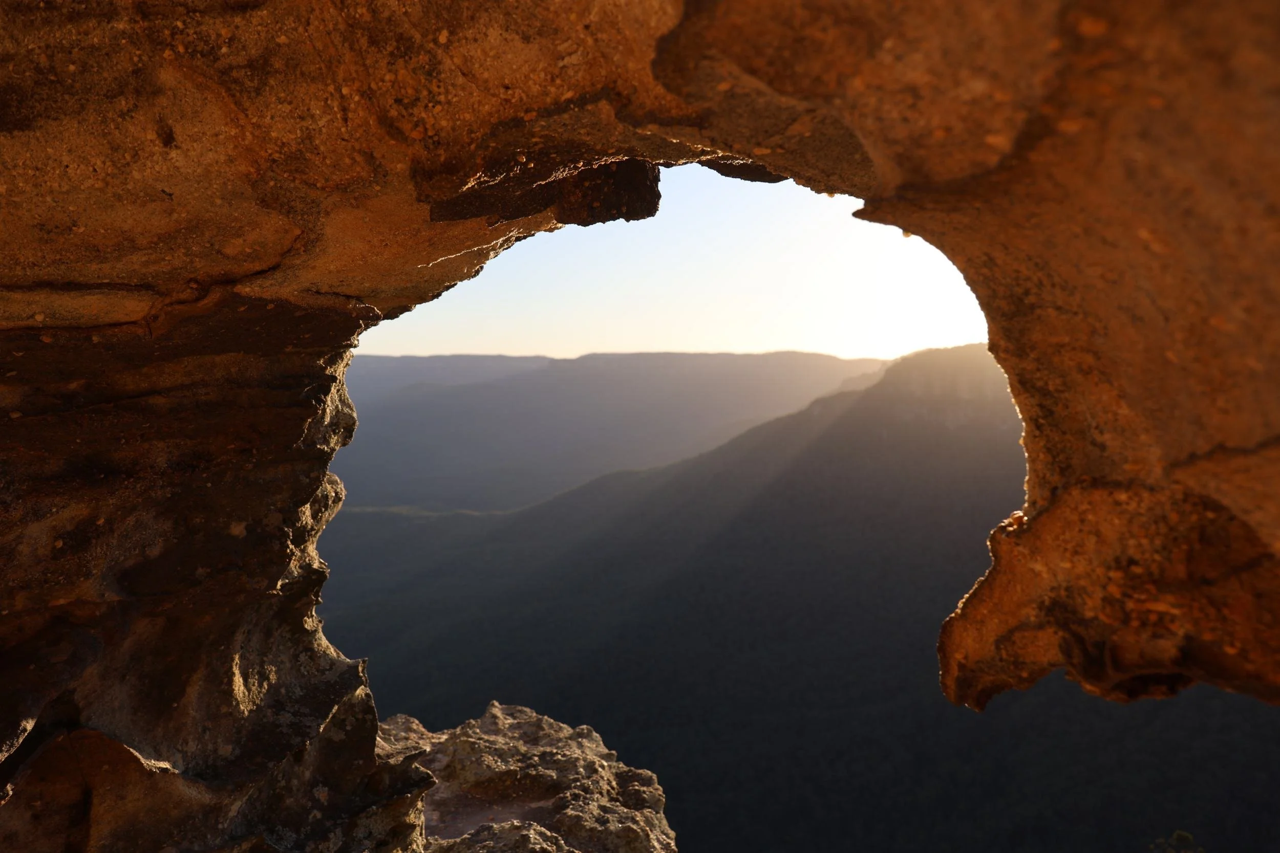 Sunset at Lincoln Rock viewed from a small cave