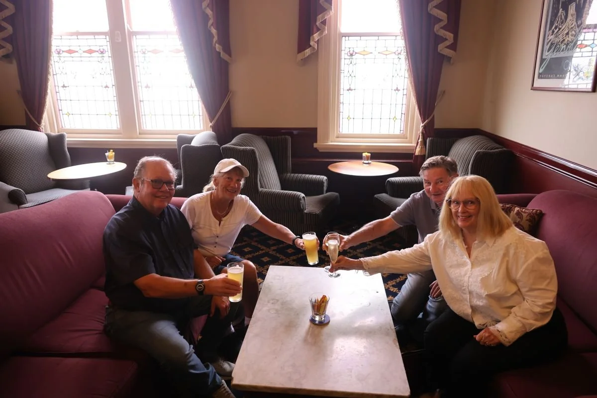 Four people celebrating a private tour