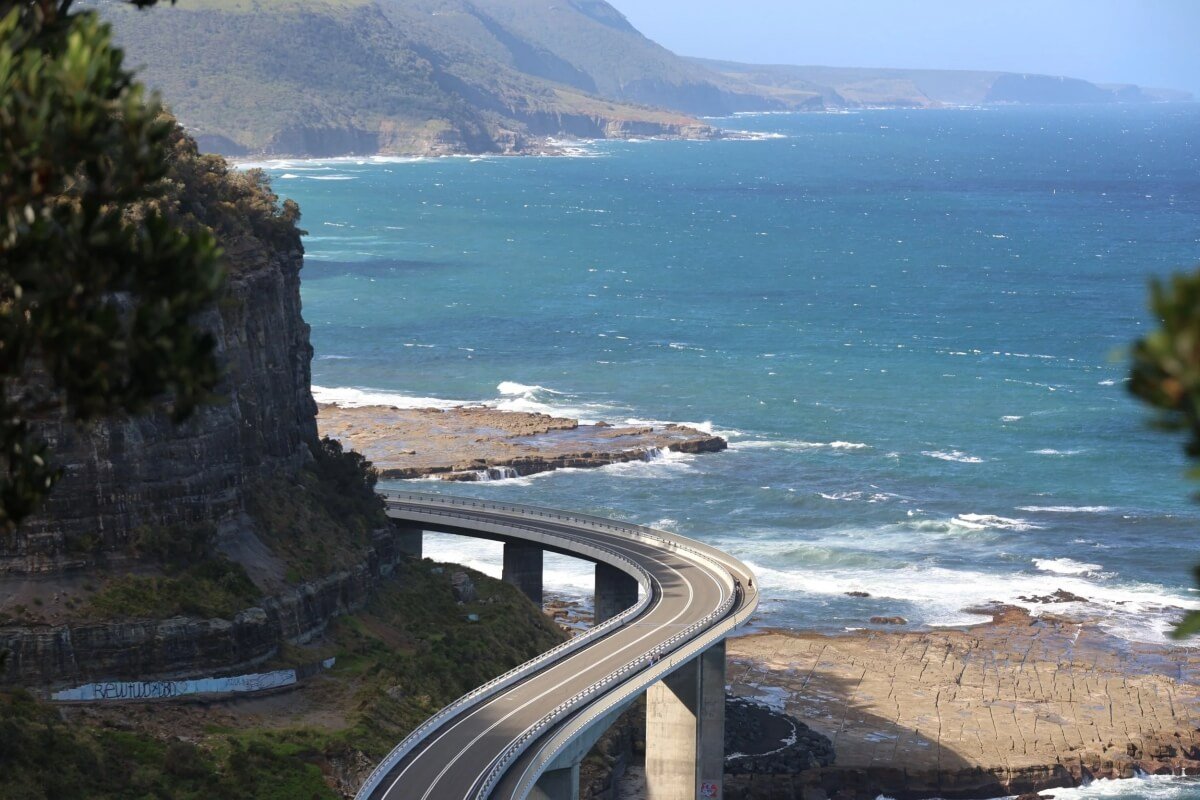 Sea Cliff Bridge viewed from the Clifton clifftop lookout with rock platform and NSW South Coast stretching south