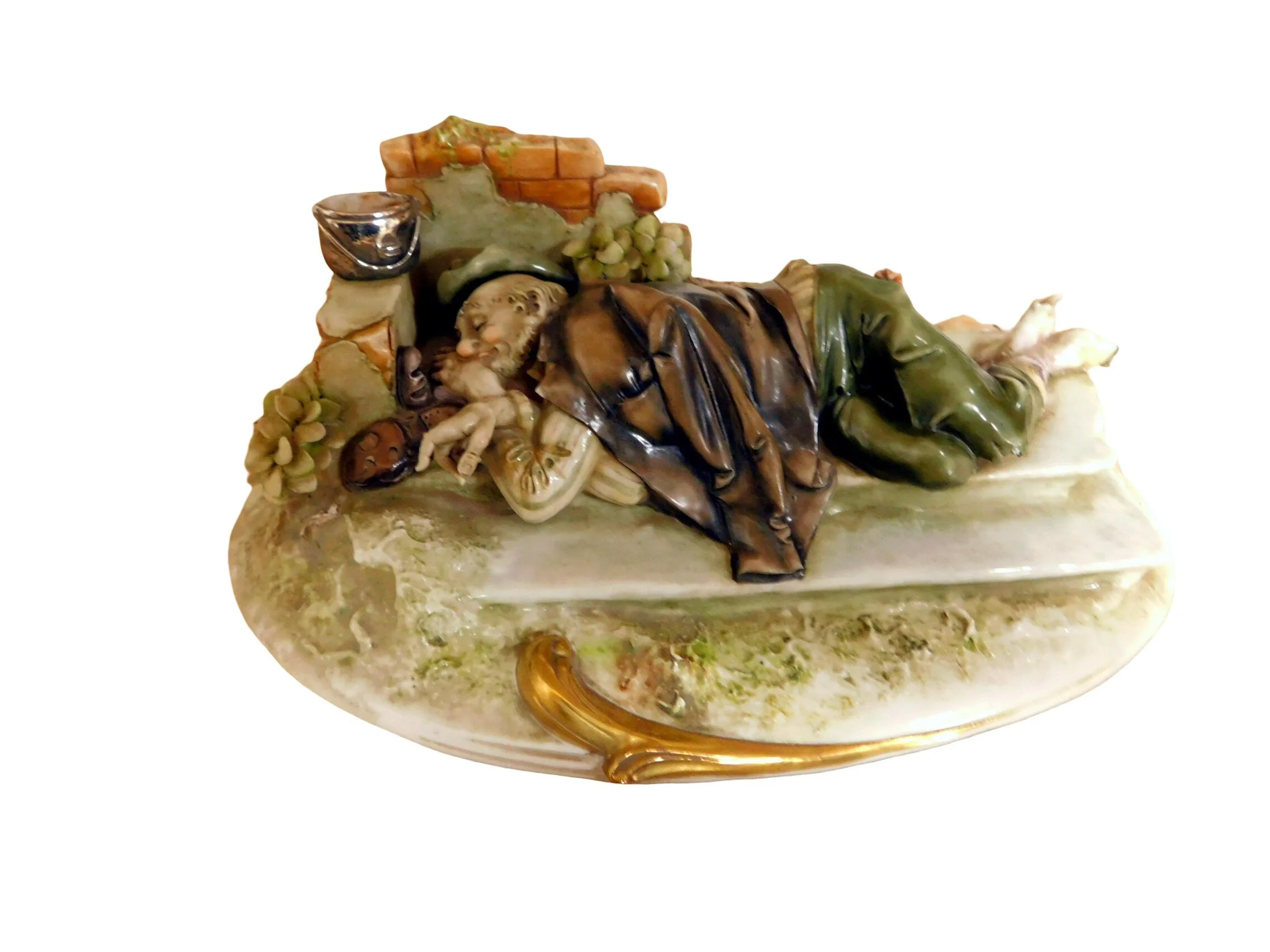 Antonio Borsato fine porcelain figurine depicting what appears to be a man sleeping outdoors, possibly on a park bench.