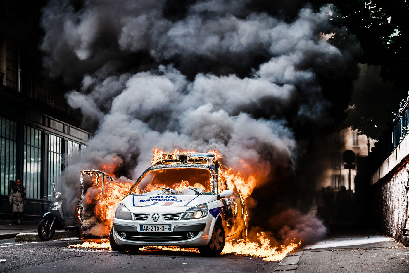 POLICE CAR BURNING DURING A PROTEST