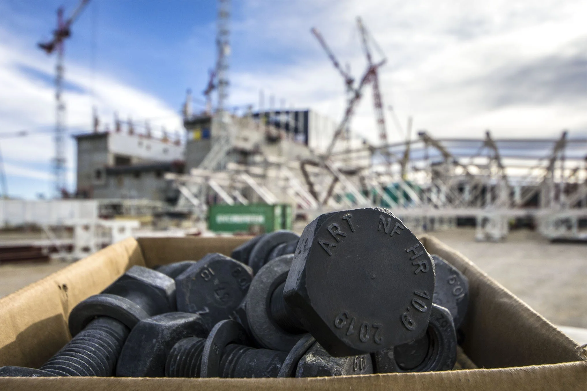 ''Sans Titre,'' created for ITER in 2019, waits with other M30 bolts for use in the Tokamak Building roof structure. Image courtesy ITER Organization
