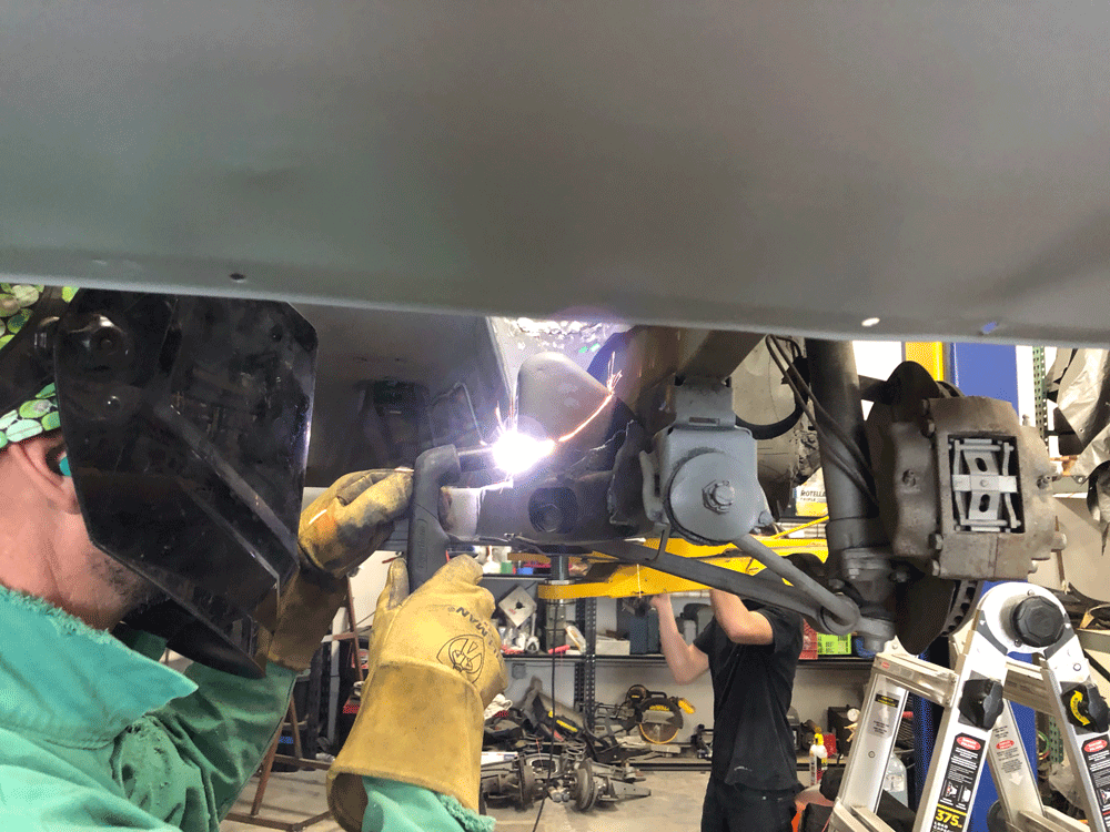 We started by cutting away a handful of motor and steering mounts from our subframe. Cutting away stuff is usually my favorite part of the project. Brett here is having a dandy time with the plasma torch.