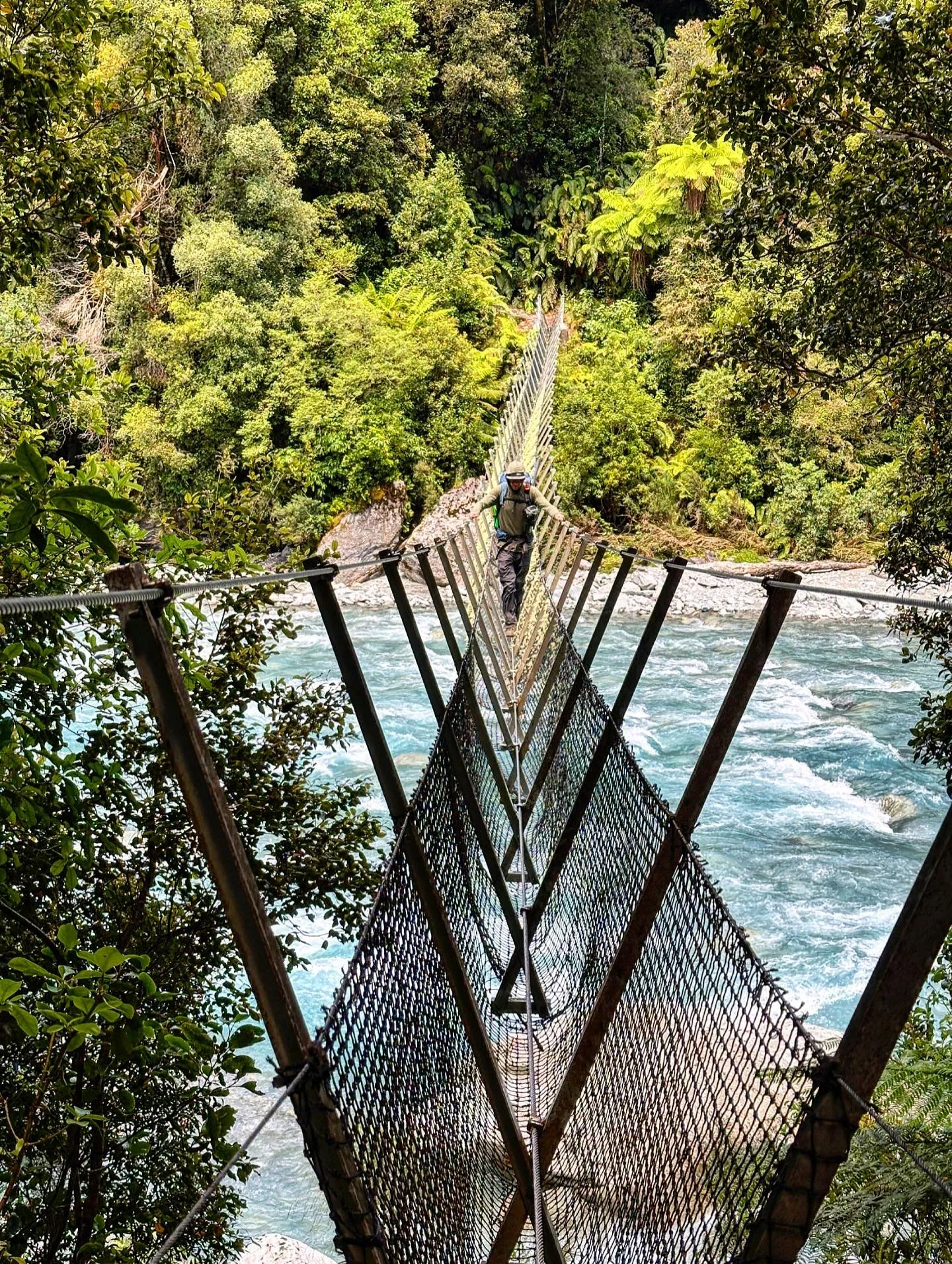 Yours truly crossing the three wire bridge across the Taipo River on the way up into the mountains.  Was our first three wire bridge experience, easier than you might think but the length of the span combined with gusty wind made for quite some sway!