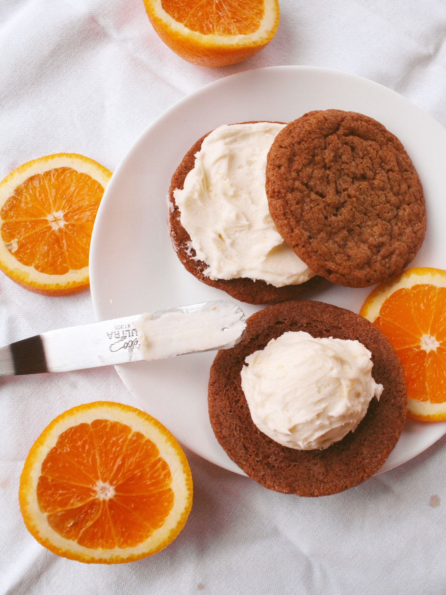 Nothing says holiday like these spiced orange ginger molasses sandwich cookies 🍊🤤 Our bakery already smells sooooo delicious with all the Christmas flavors we have in the works! Come &amp; grab one of our new menu items (or try them all! we know ya