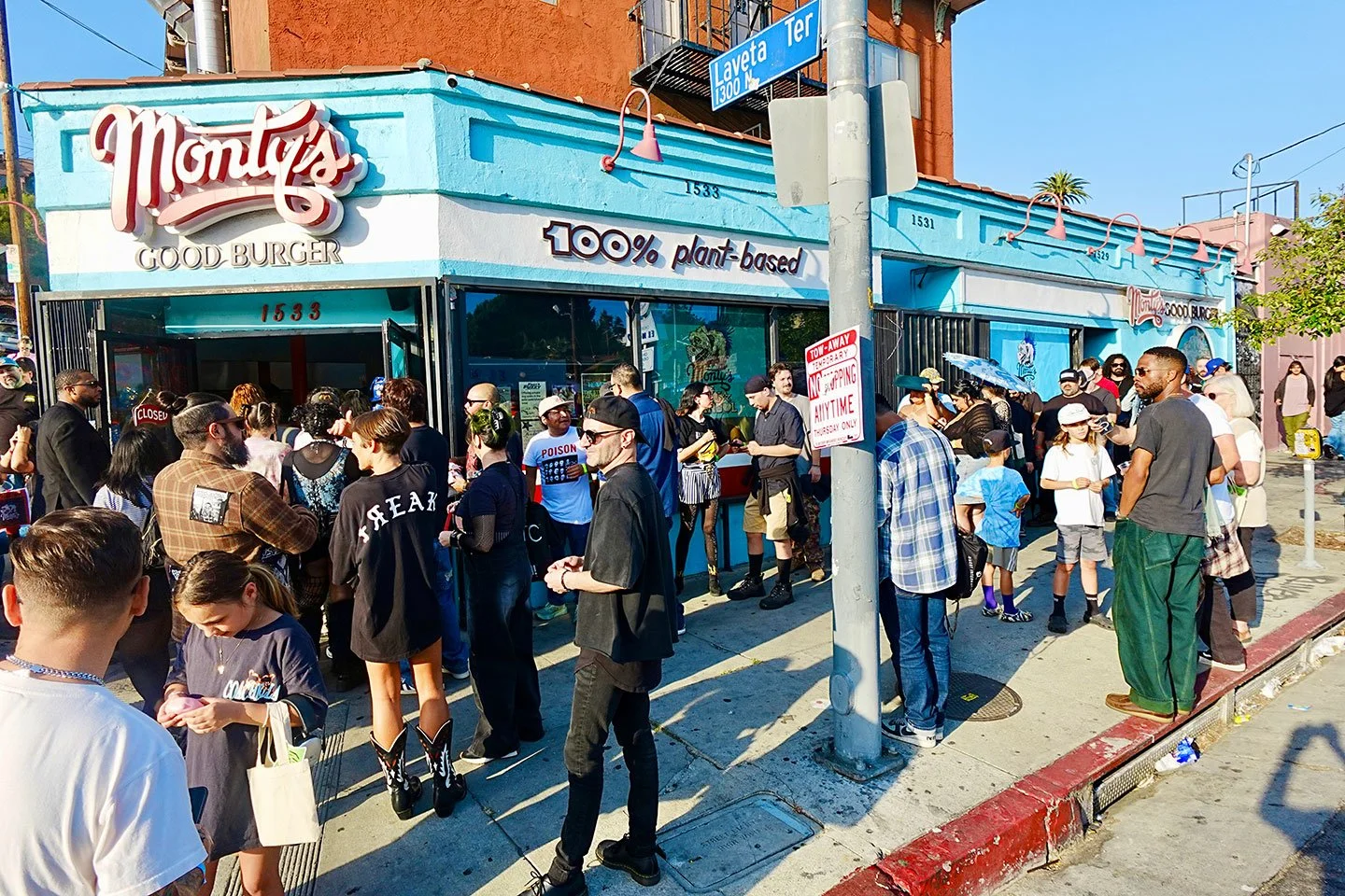 A massive crowd of hungry fans lined up down the sidewalk outside the bright blue Monty's Good Burger storefront, proving it is the top choice for plant power fast food in Los Angeles.