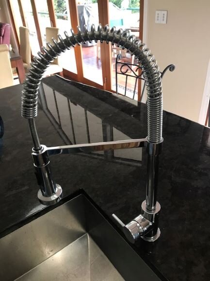 Ormeau Plumber installs kitchen mixer tap