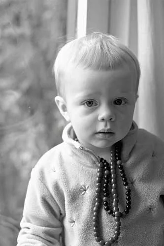 Here is an illustration of how soft the light from a window can be. The photo was taken in overcast weather and the window is acting like a giant softbox for this portrait. The closer the subject is to the window, the softer the light. If you're not sure what is meant by soft light this will be explained in Part 5, but for now notice how the edges of the shadows are blurred and the transitions between light and dark are softened.