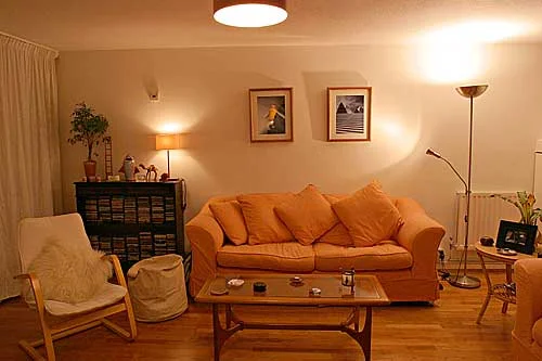 This is a fairly typical interior with several lights used to create atmosphere, notice the various methods used to soften the light with lampshades and by bouncing the light off the wall. As a result of using a number of diffused lights in this manner there are no hard shadows. In this image I've tweaked the white balance to make it a lot less orange as the real colour of tungsten lighting doesn't look realistic, but using a mellower suggestion of orange looks quite convincing and conveys the colour we actually perceive ourselves.