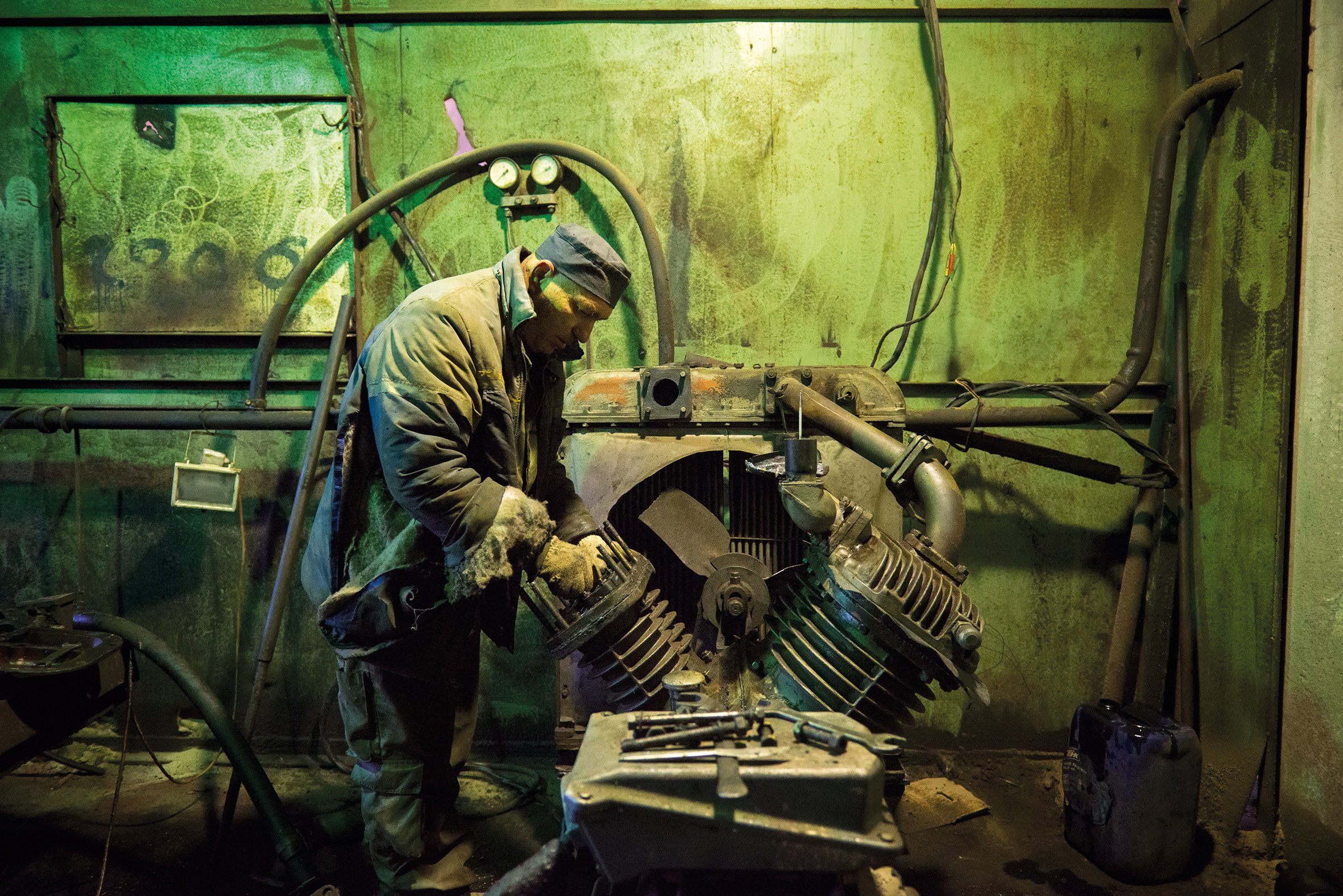 Pasha repairing an engine.jpg