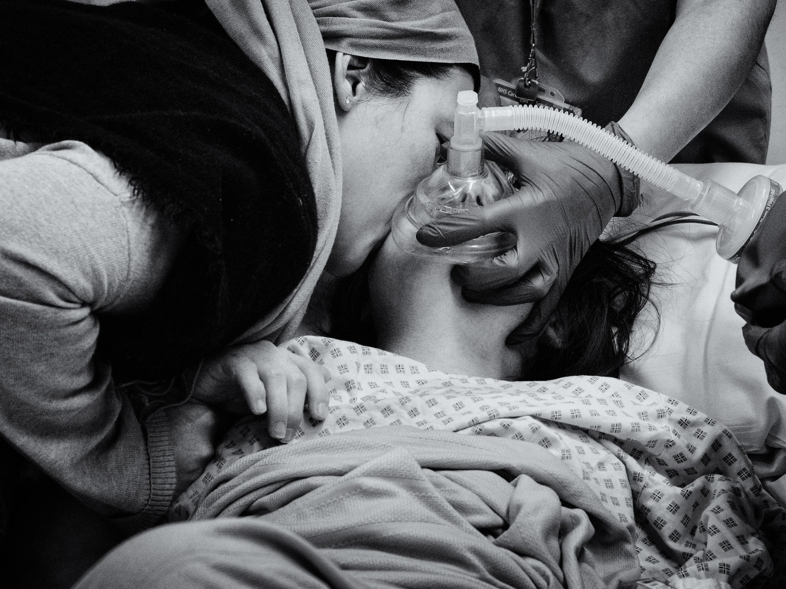 Annalisa kisses Maria before her massive intestinal surgery.jpg