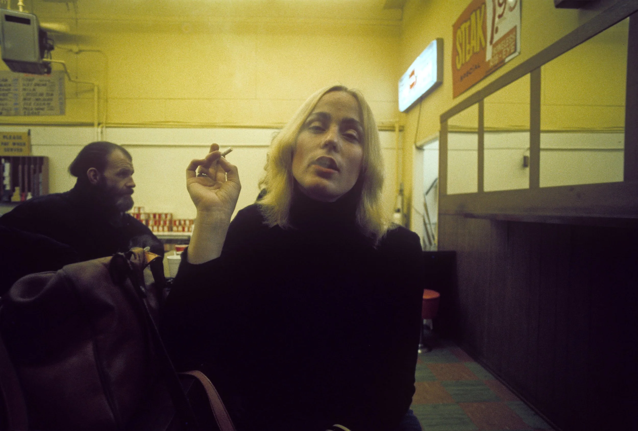 P82_Woman_with_Cigarette_Steams_Cafe_1975.jpg