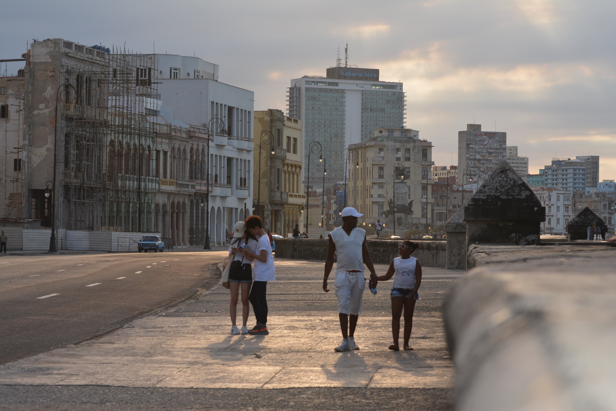 People strolling in Malecon in Havana in Cuba