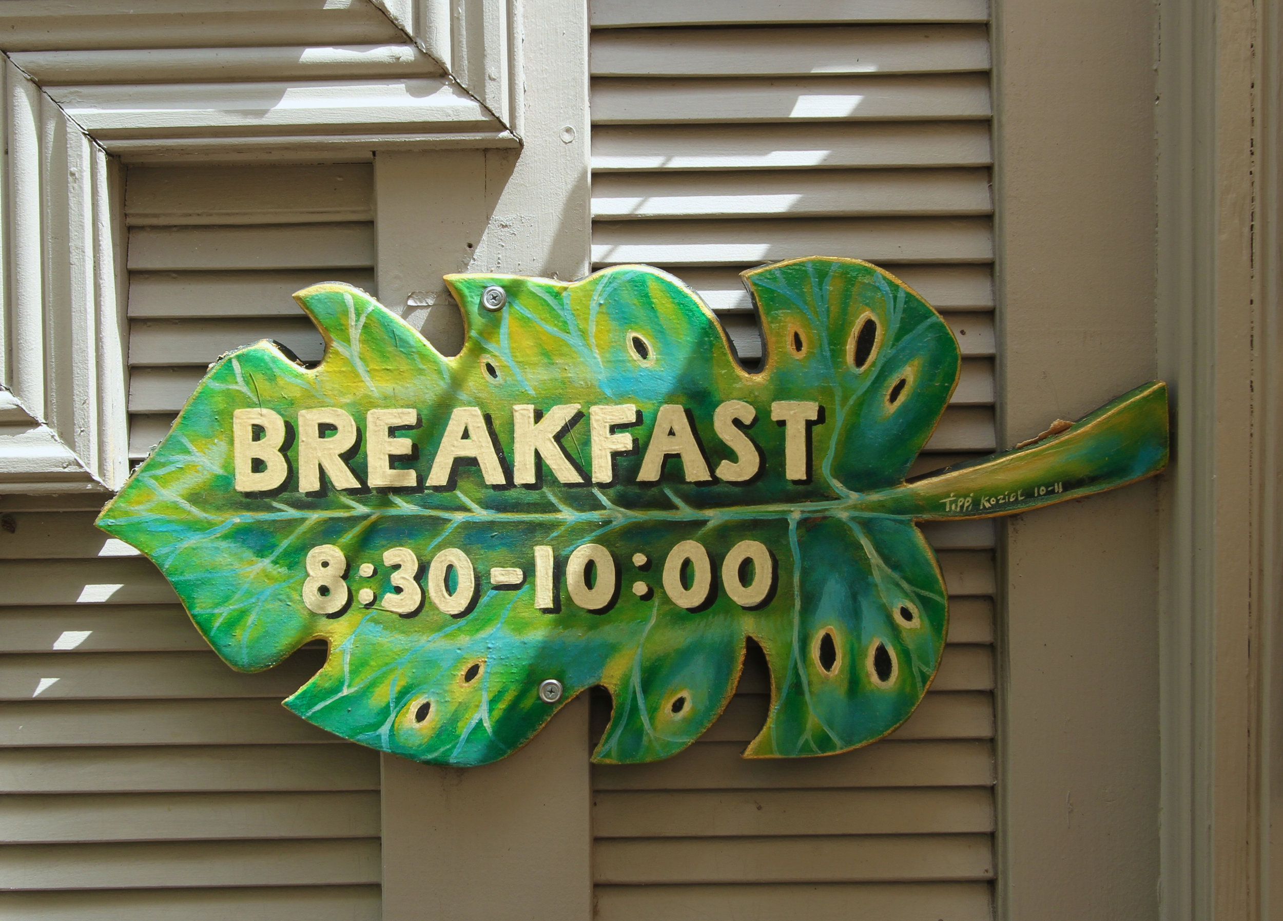 palm frond sign. breakfast 8:30am to 10am.