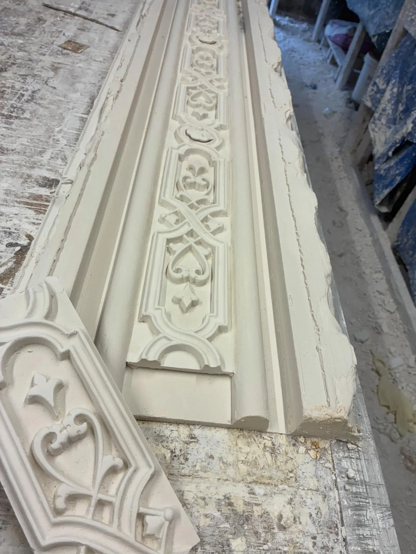 Setting down the enriched plates and pour rubber over later for ceiling restoration job.