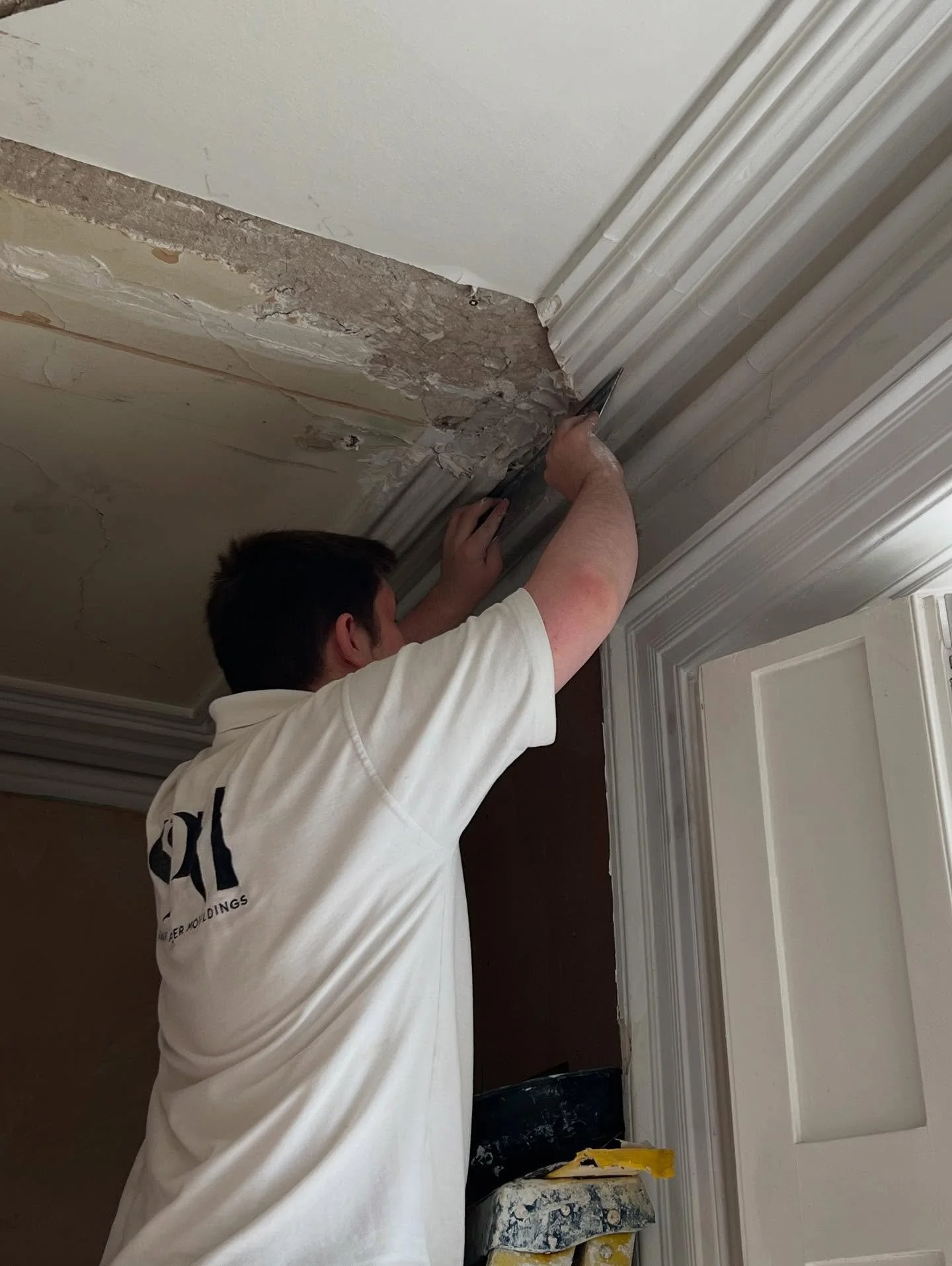 Our apprentice, Josh stopping in the gap following the removal of false wall in this Georgian manor.  Good lad.