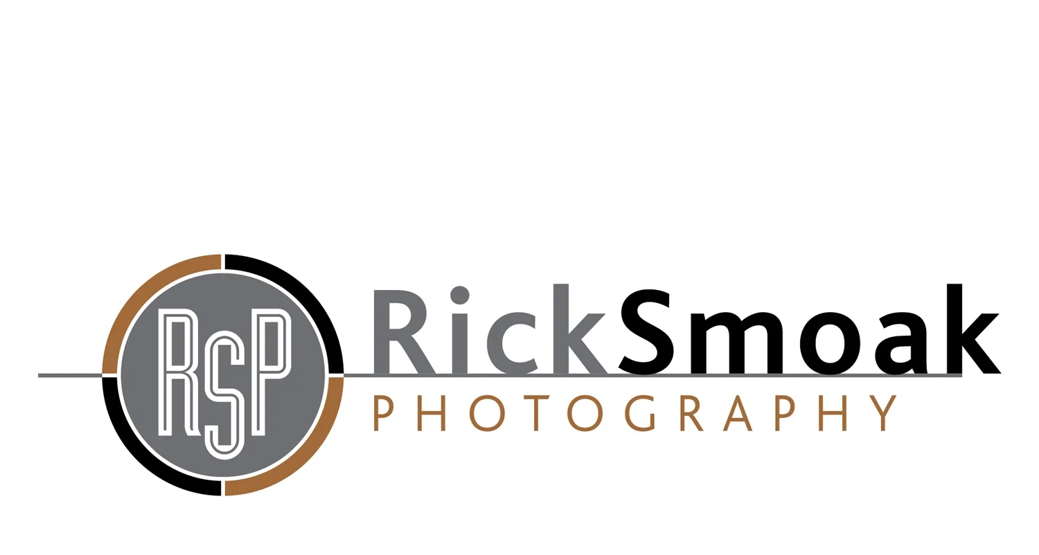 Rick Smoak is one of South Carolina’s most talented professional photographers. The circular mark loosely represents a camera lens. While the “k” stepping off the edge of the line, represents Rick’s creativity and willingness to take risks in order to get just the right image.