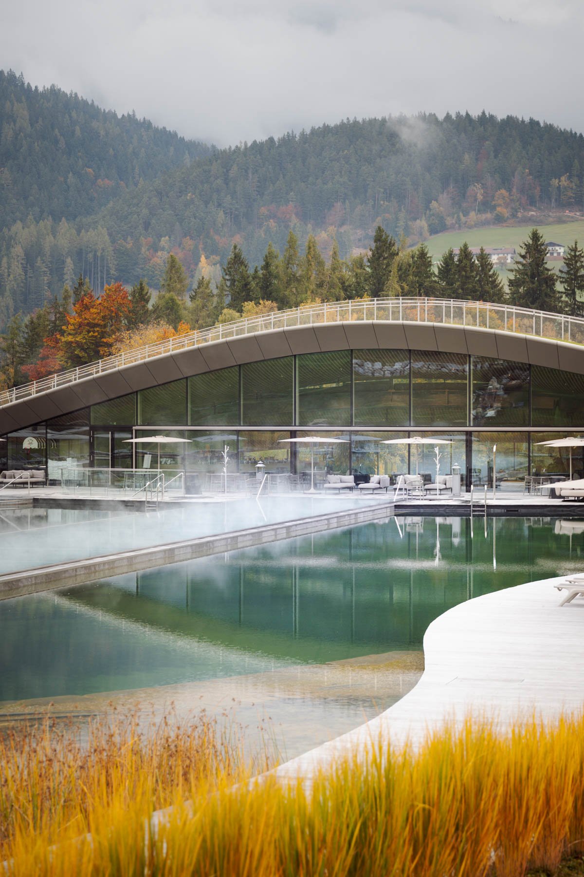 Side view of spa pool and interior, harmoniously blending with nature.