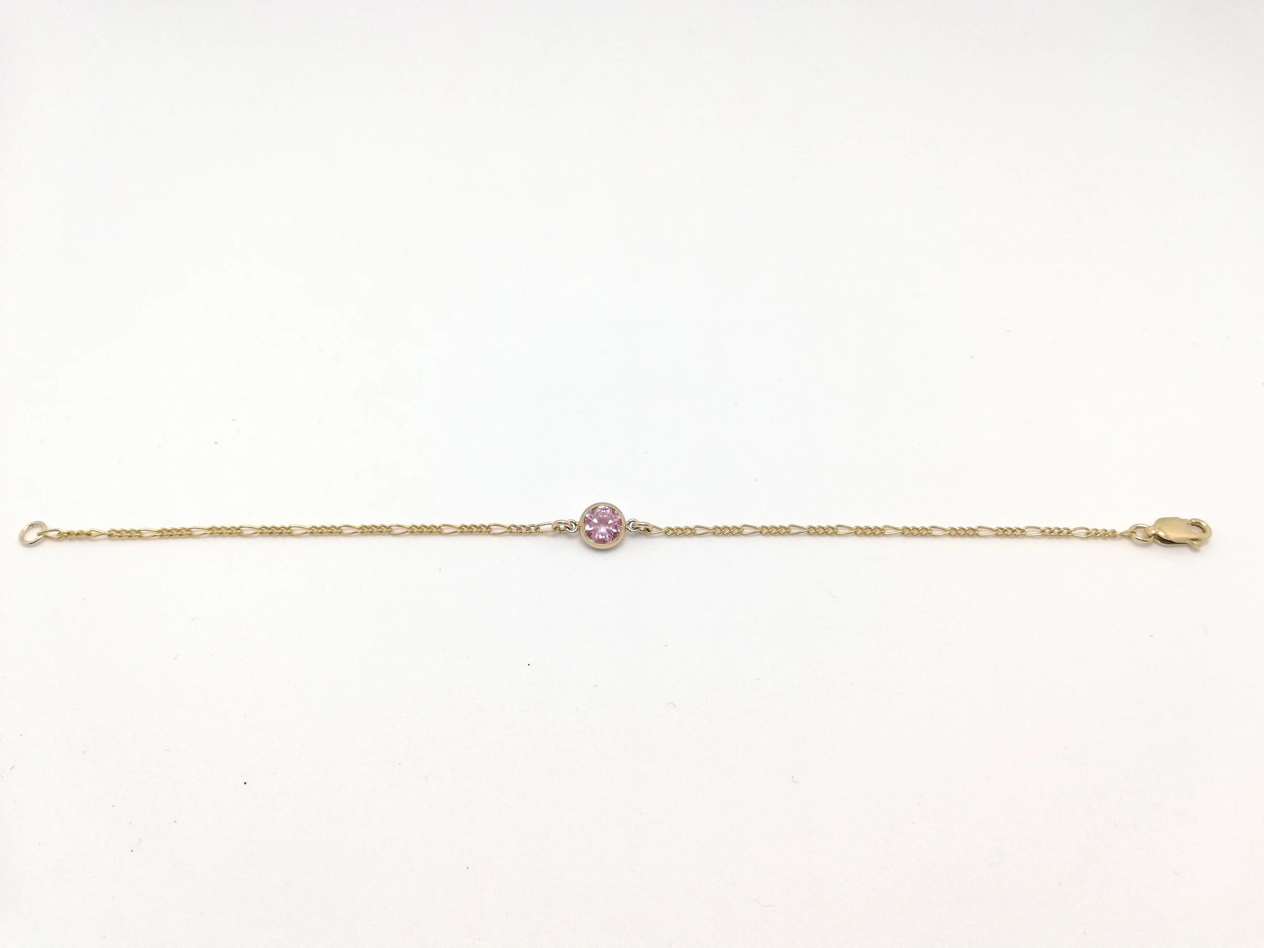 dainty friendship bracelet in pink zirconia and 14ct yellow gold fill
