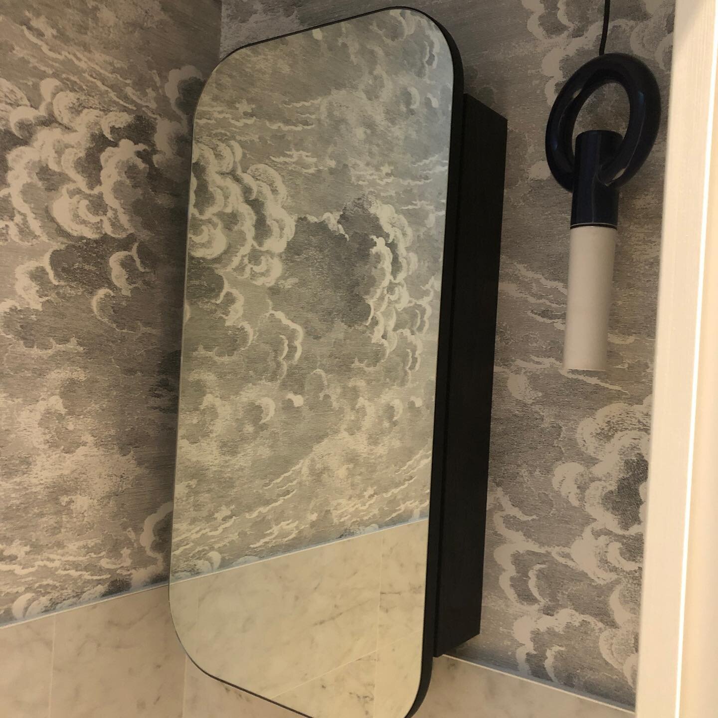 Turning the smallest of rooms into a favourite. This powder room packs a punch, with terrific use of natural light, hidden pelmet lighting and a feature pendant to compliment  custom mirror and wall paper. .  Design and interiors @brookeaitkendesign 