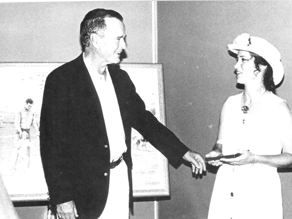 Nicole Kroeger presents her painting "A Measure of Success" to George Bush Sr. 1995. 