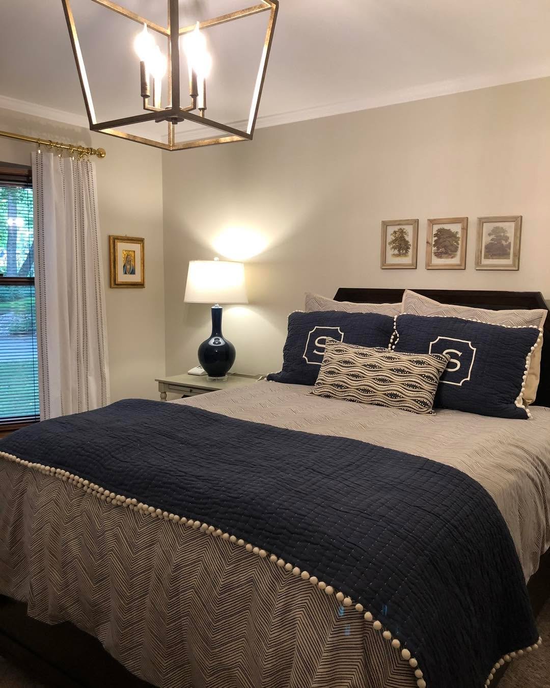 {Note from Kristin} . . . this beautiful primary bedroom suite was refreshed by my team several years ago but still looking fresh and classic! Navy is just one of those colors that stays crisp and traditional and timeless. We had ceiling work done, p