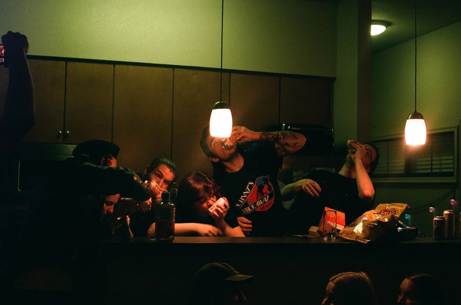 This photo may be my favorite of the whole tour. One night we had an Airbnb and housed around 5 bands. That’s about 20 people. That was a whole night of new friends and craziness. Everywhere you turned there were people. In every room, even outside. Not once was someone thinking they were better than another and everyone was simply getting along. Of course having a bunch of bands in one house that meant drinks on drinks on drinks. Everywhere you turned there were beer bottles. These people in the photos didn’t know each other till this night. Yet it felt like we were all best friends. We stayed there for two nights and one night the cat disappeared and we later found it outside... thank god we found it beforehand.... this was taken when everyone decided to shotgun beers but of course not after someone’s beer had exploded. By the end of the 3 days it smelt like beer and shoes... sharing 2 bathrooms with about 15-20 dudes is something you would never want to do. Yet I would do it all over again. Some bands had toured previously with each other and seeing them see each other again was the sweetest family reunion ever. This by far was my favorite night of tour.