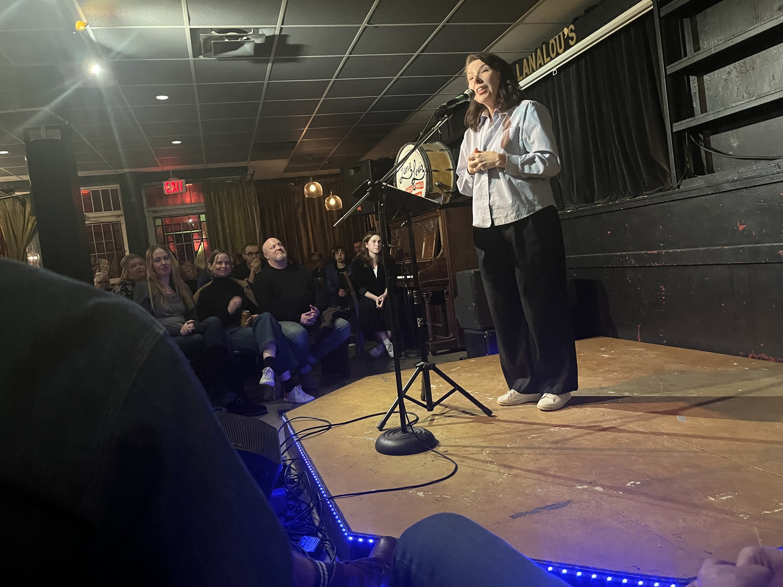 Woman telling her story on stage in Vancouver