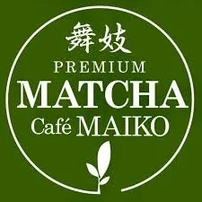 Green circular logo with Japanese characters and text promoting Premium Matcha from Café Maiko, featuring a small leaf illustration.