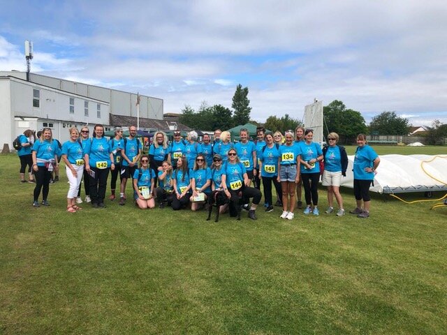 New: Over 100 staff raise thousands for charity by walking up to 30 miles across the hills