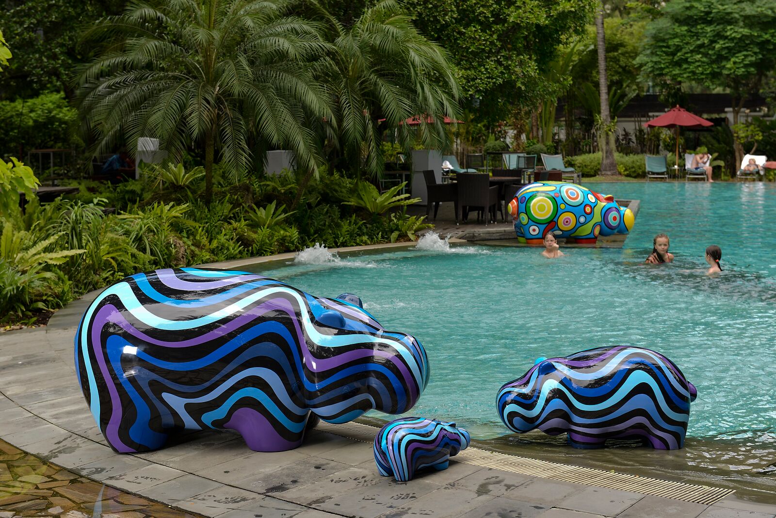 Hippop Art Artheline Pop art hippo sculpture hotel pool