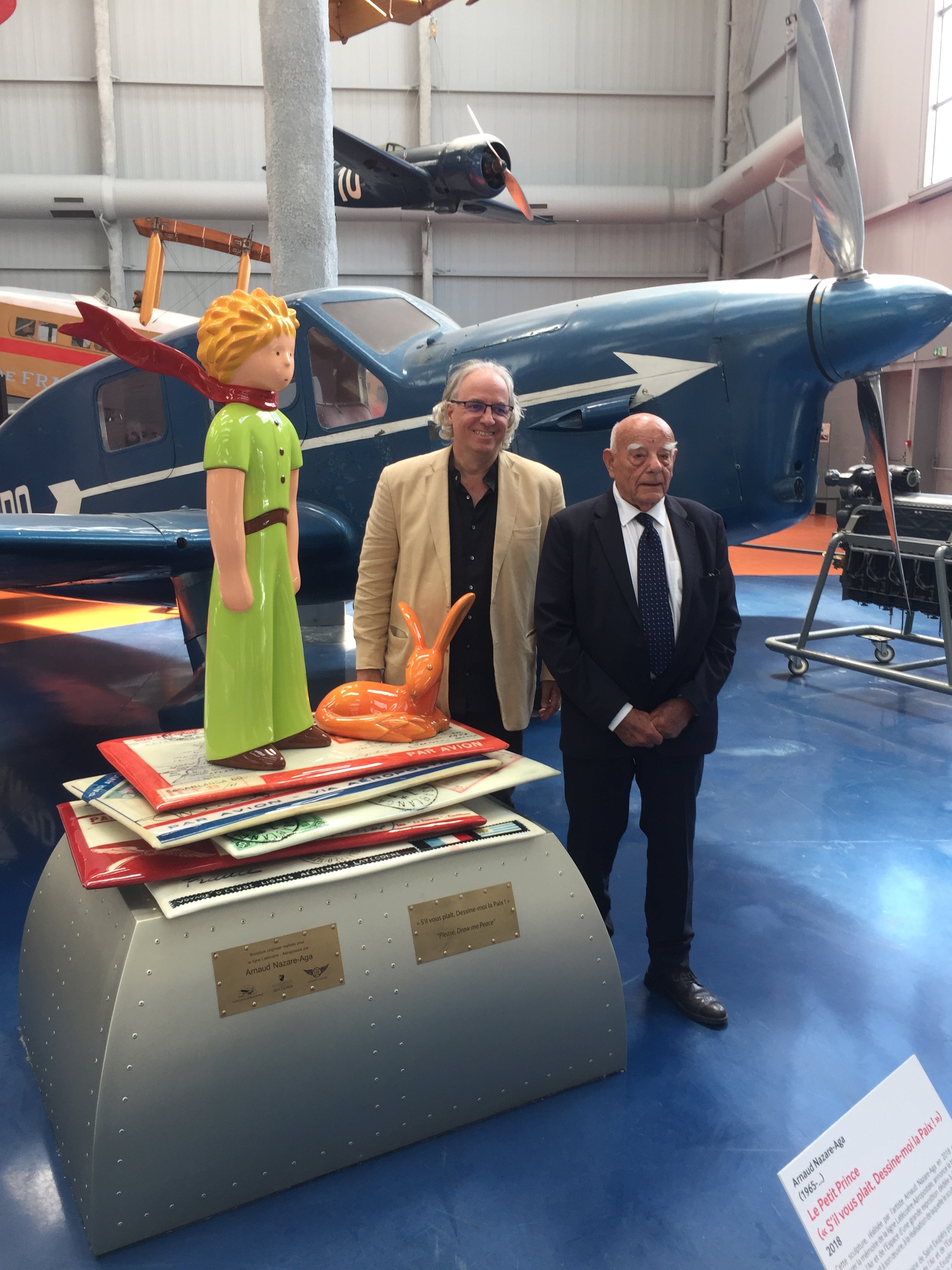 François D'Agay, nephew of Antoine de Saint-Exupéry &amp; Arnaud Nazare-Aga next to The Little Prince in the Air &amp; Space Museum of Paris