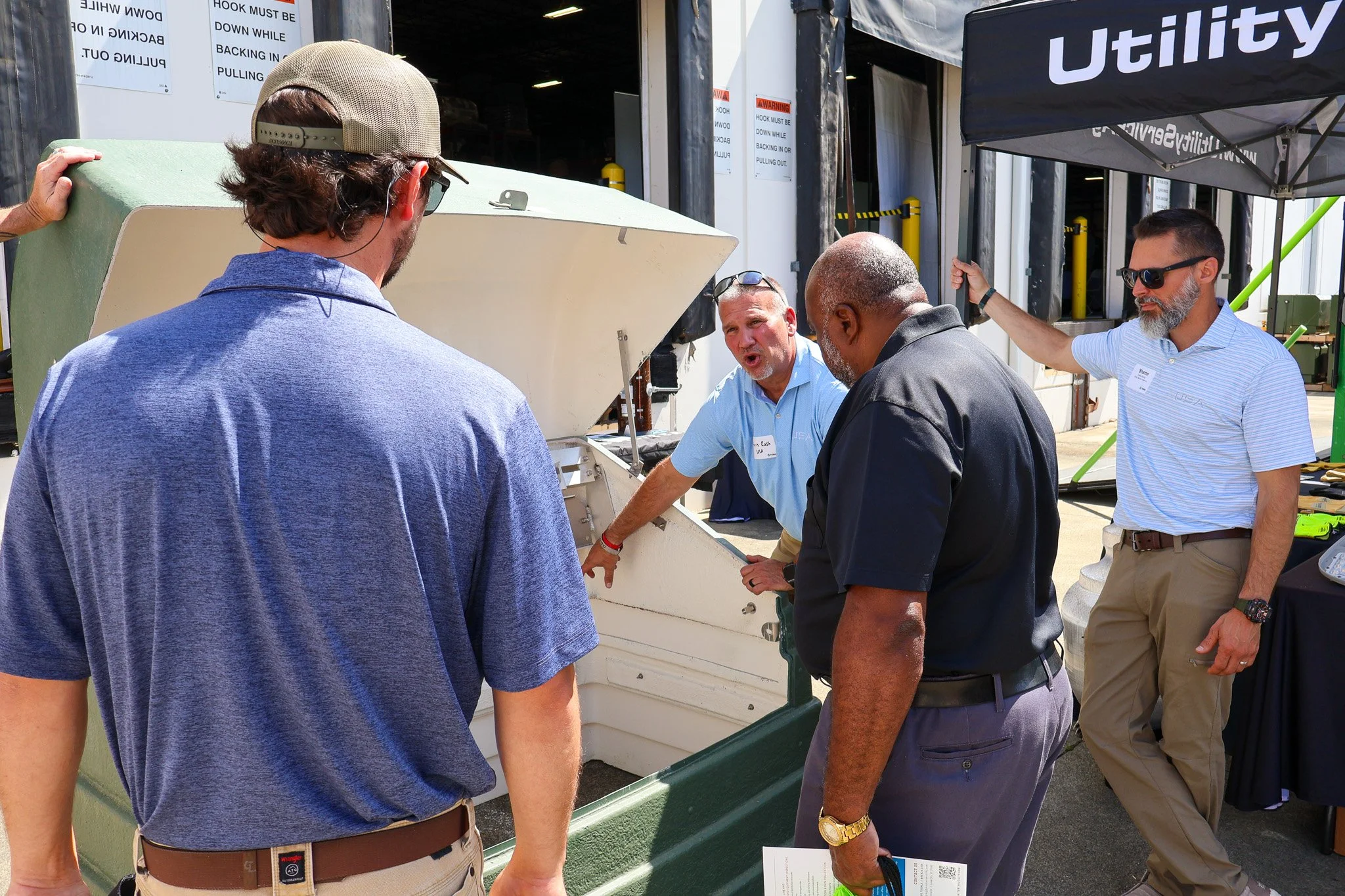 Director of Sales Chris Rush demonstrates the features of Power Design Inc. cabinets for a crowd at the 2026 TEMA trade show