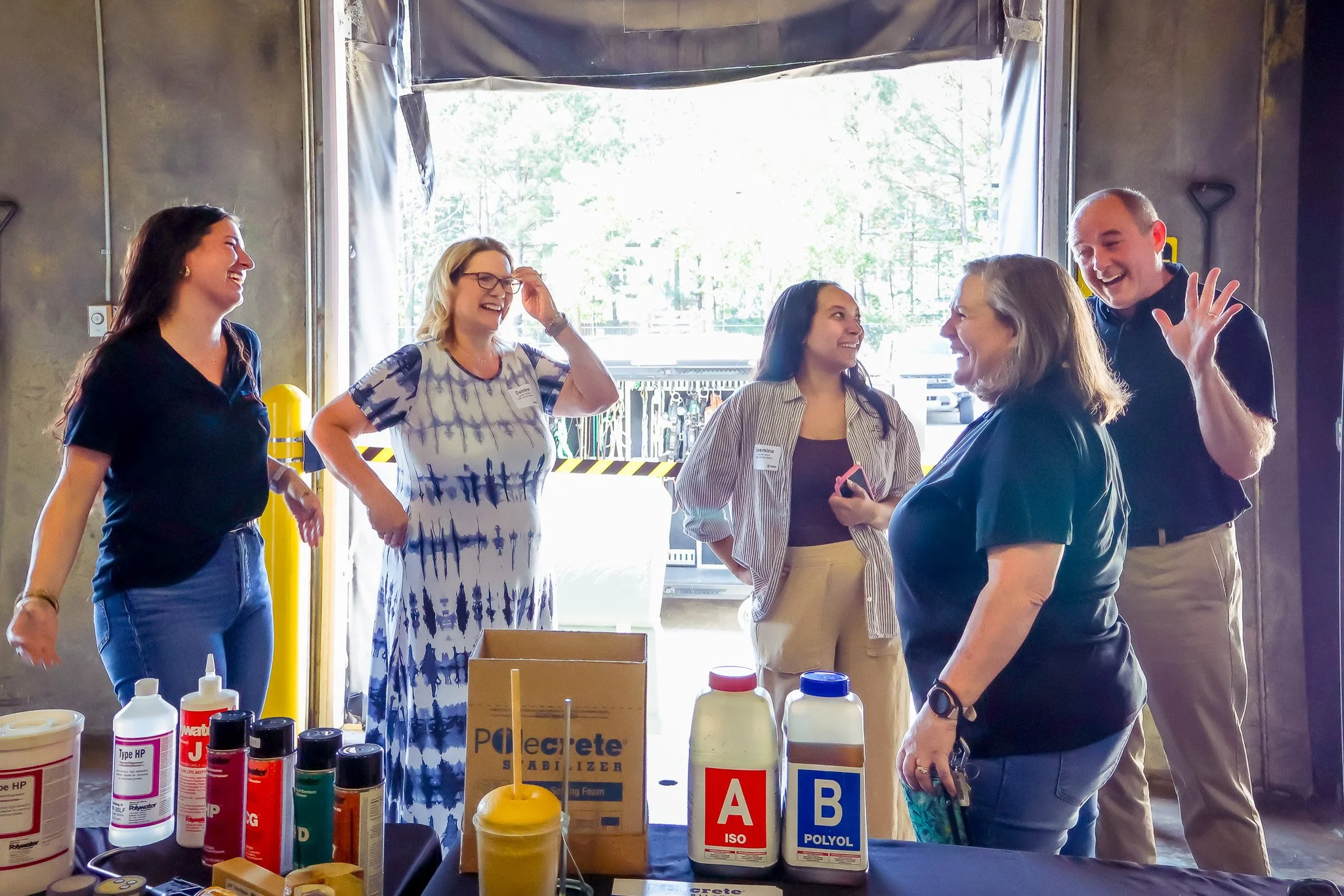 Sara McIntosh of Bulldog Pipe joins a few members of the USA inside sales team in sharing a laugh at the 2026 TEMA trade show
