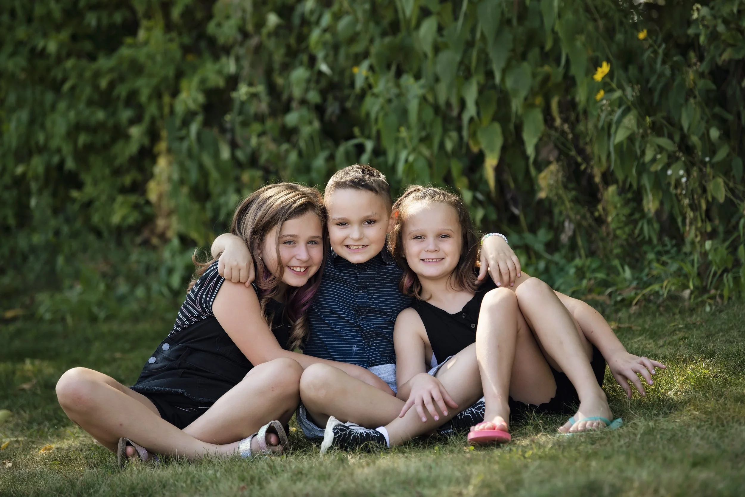 Siblings in an outdoor family session.jpg