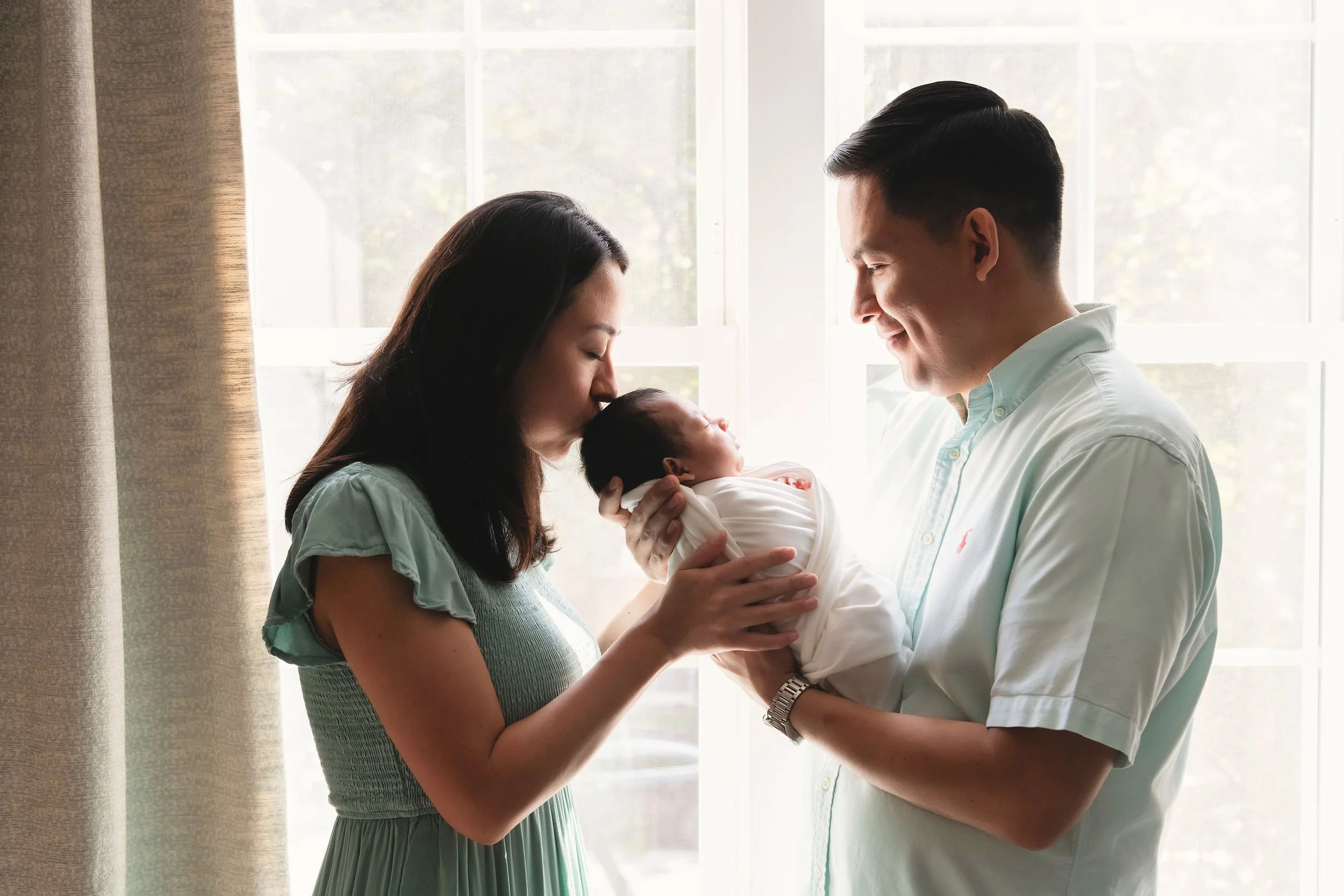 Parents and newborns in newborn photo session
